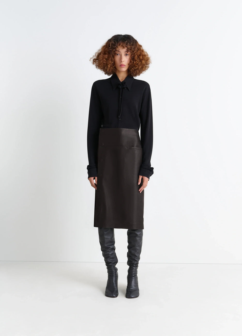 Lemaire Leather Wrapover Skirt in Supple Cow Leather, model shot, Front view Wrapover with snap closure