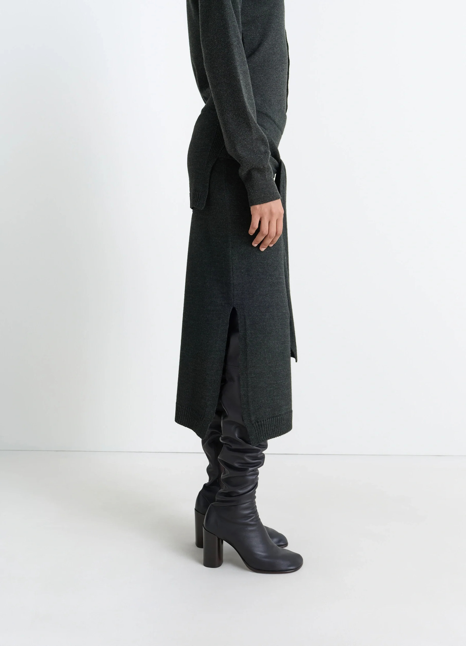 Lemaire trompe loeil skirt in blended merino wool, model shot, profile view side slit exposure