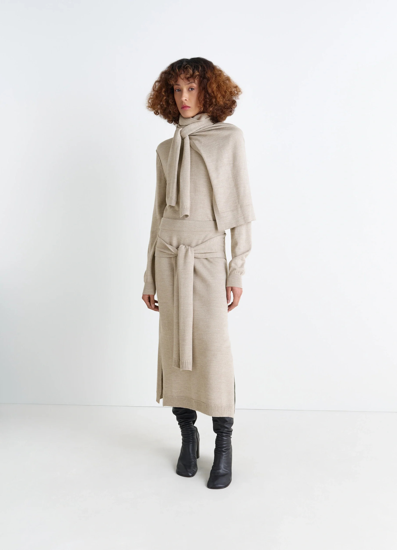 Lemaire trompe loeil skirt in beige blended merino wool, model shot, front view sweater-style tie panels