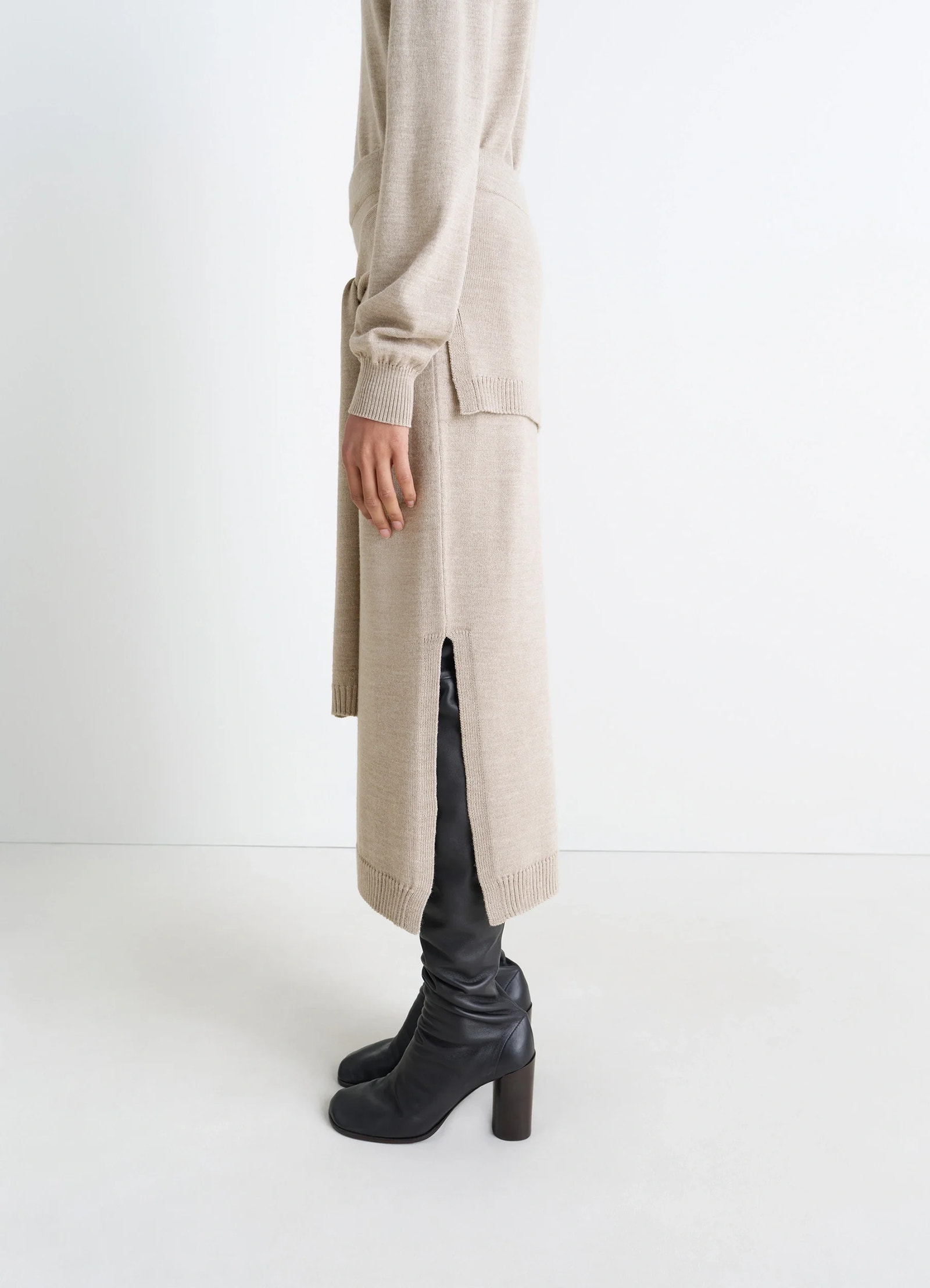 Lemaire trompe loeil skirt in beige blended merino wool, model shot, right side view sweater tie panels side