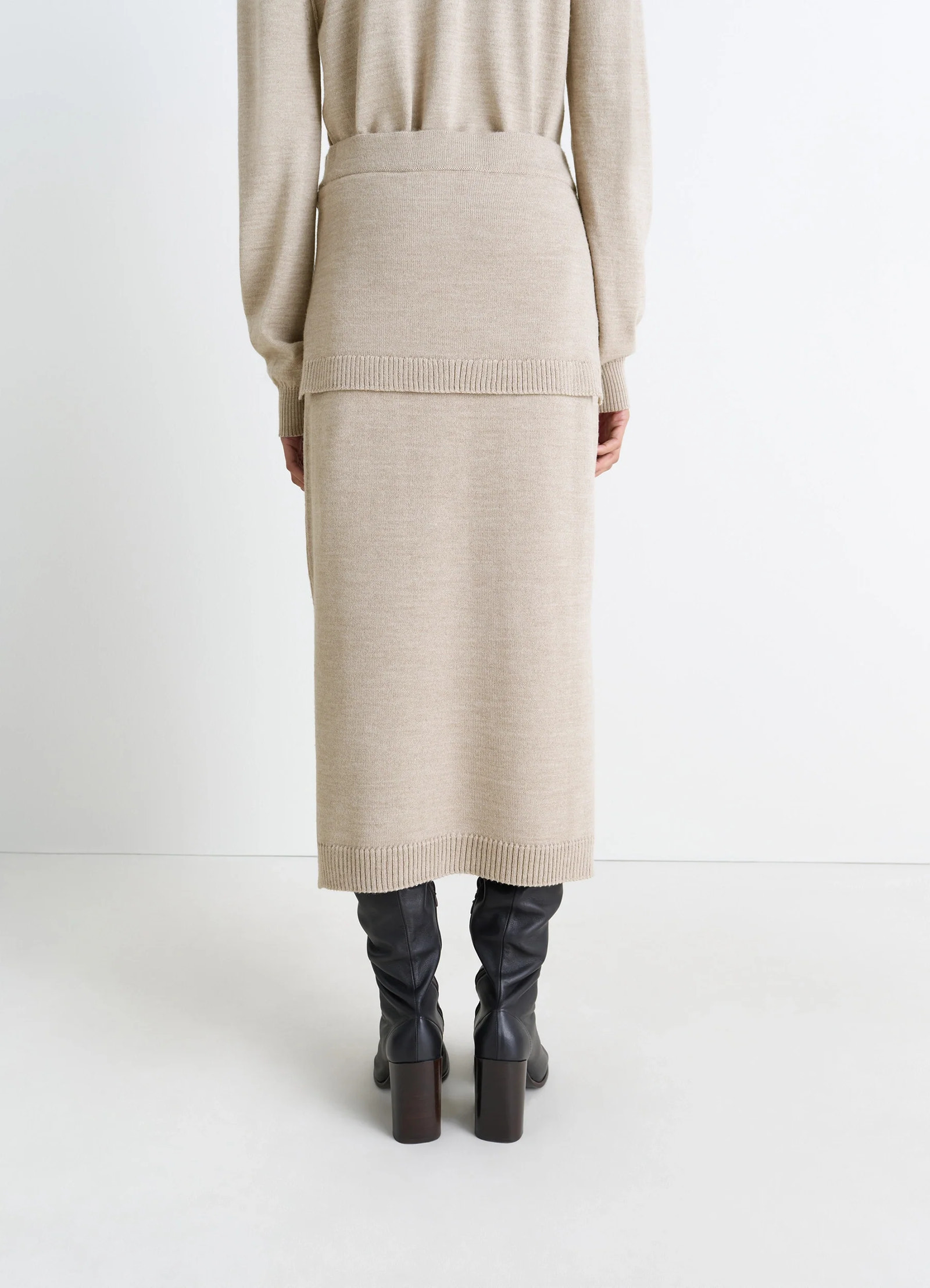 Lemaire trompe loeil skirt in beige blended merino wool, model shot, back view sweater-style tie panels back
