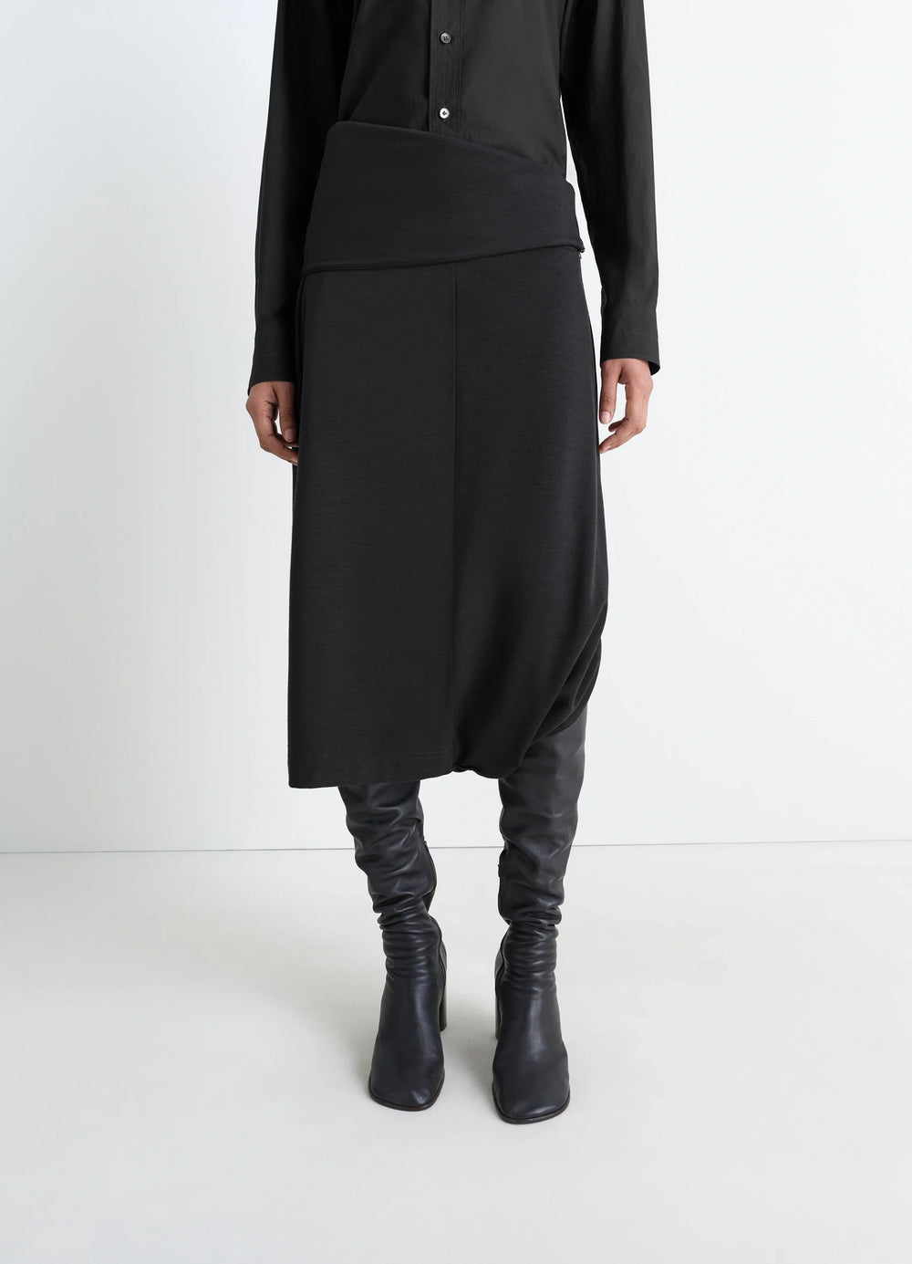 Lemaire Twisted Hem Dress in Black Wool Viscose-Blend, model shot, side view asymmetric hem detail