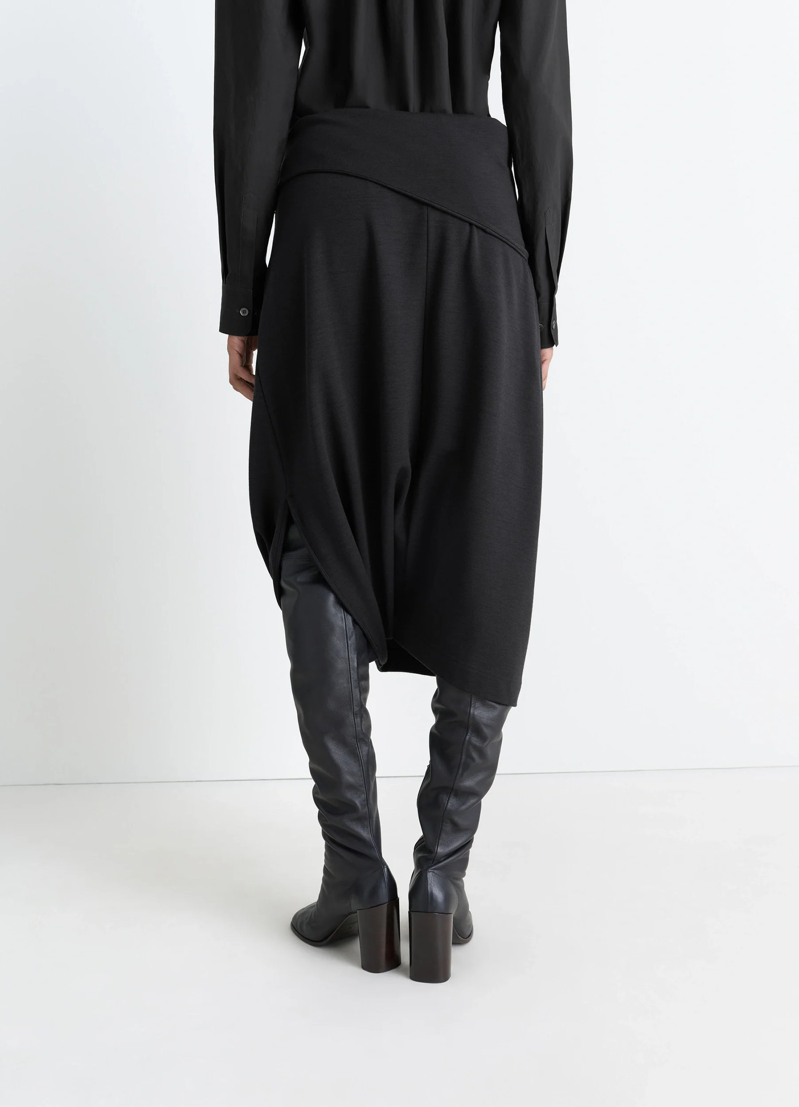 Lemaire twisted hem dress in black wool viscose-blend, model shot, back view asymmetric waist