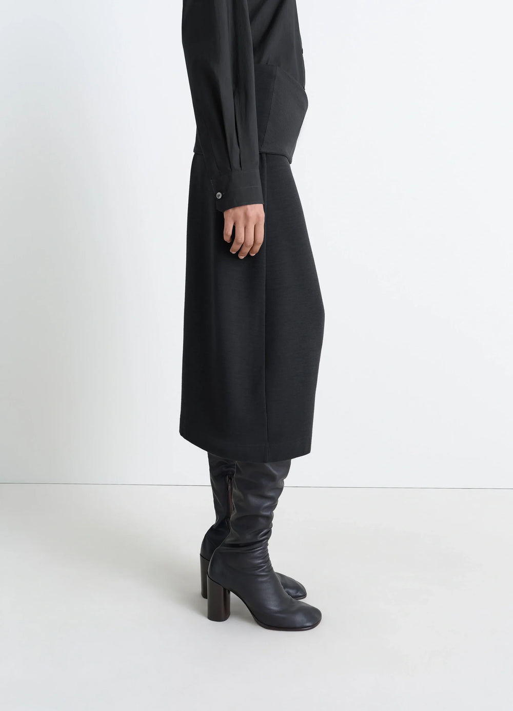 Lemaire Twisted Hem Dress in Black Wool Viscose-Blend, model shot, three-quarter view draped fabric profile