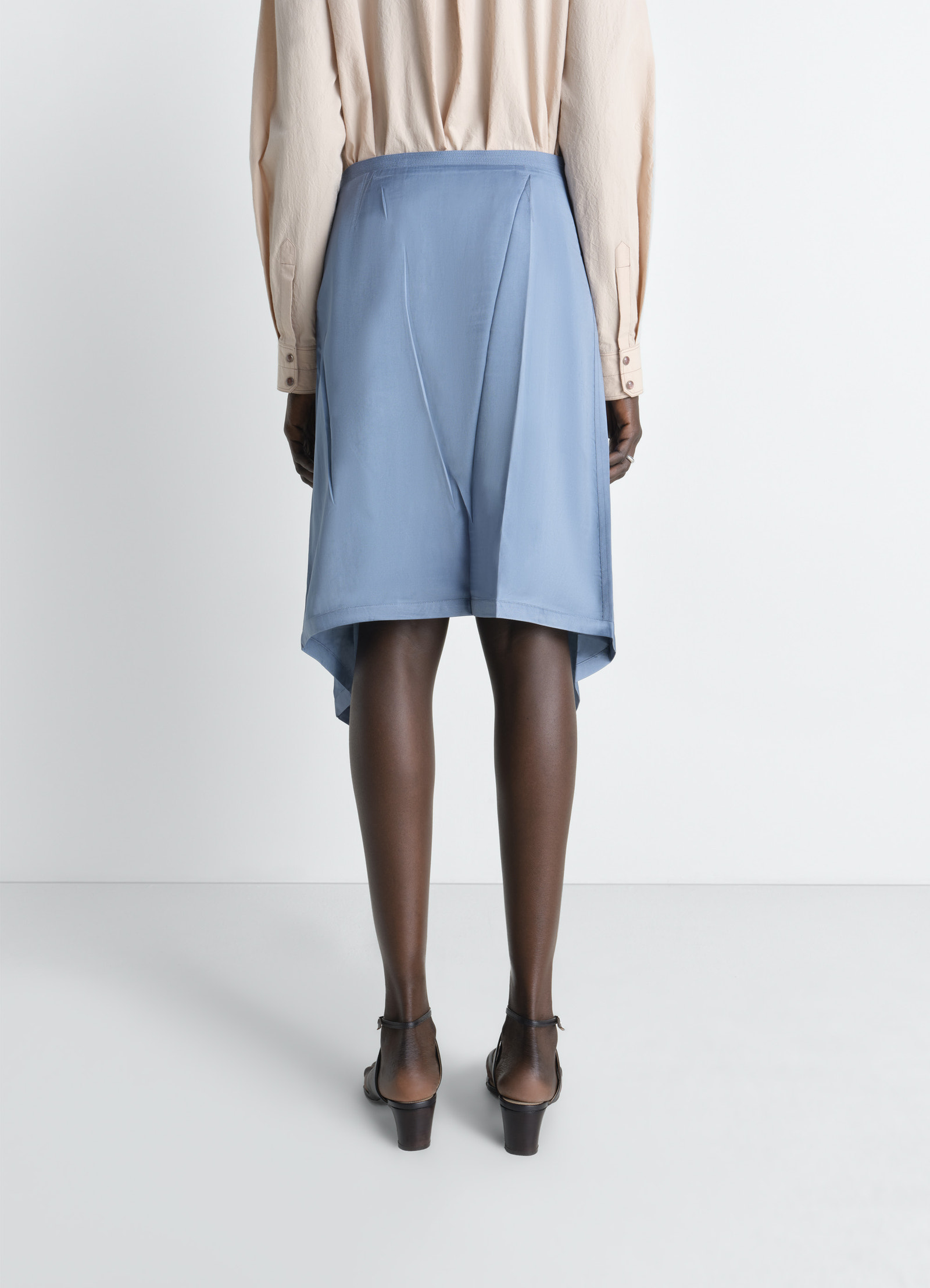Creased foulard skirt in poly viscose twill, model shot, back view tapered back drape