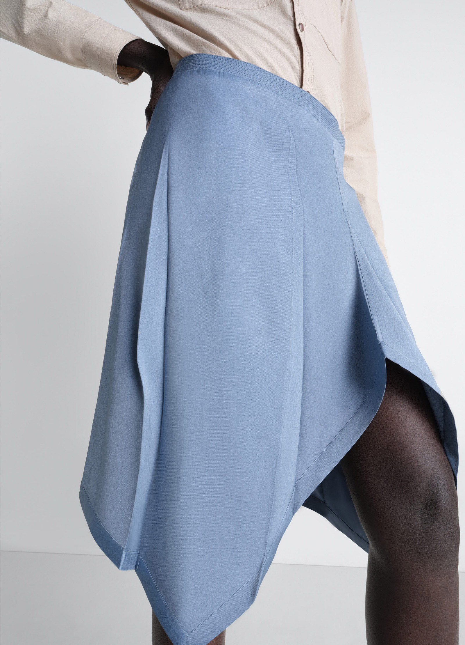 Creased foulard skirt in poly viscose twill, model shot, close-up angle waistband focus and drape