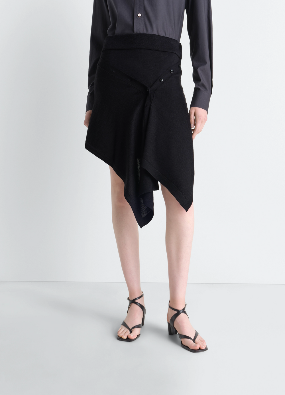 Lemaire Buttoned Skirt in Black Merino Blend, model shot, side view draped detail