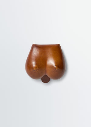 Carlos breasts coin purse in smooth patina leather, product shot, front view sculptural shape