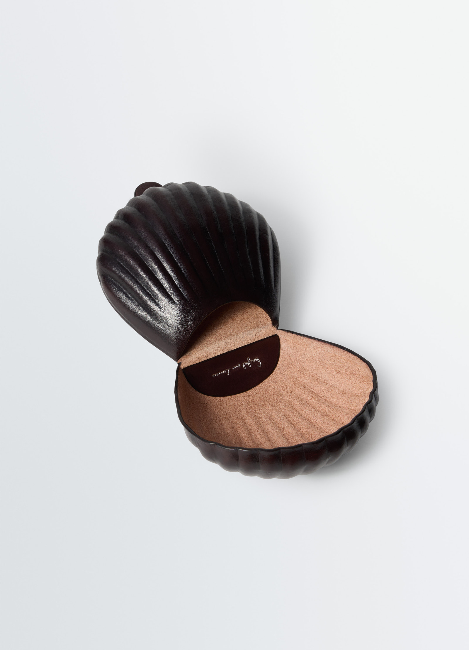 Carlos shell coin purse in smooth patina leather, product shot, angled open view textured interior