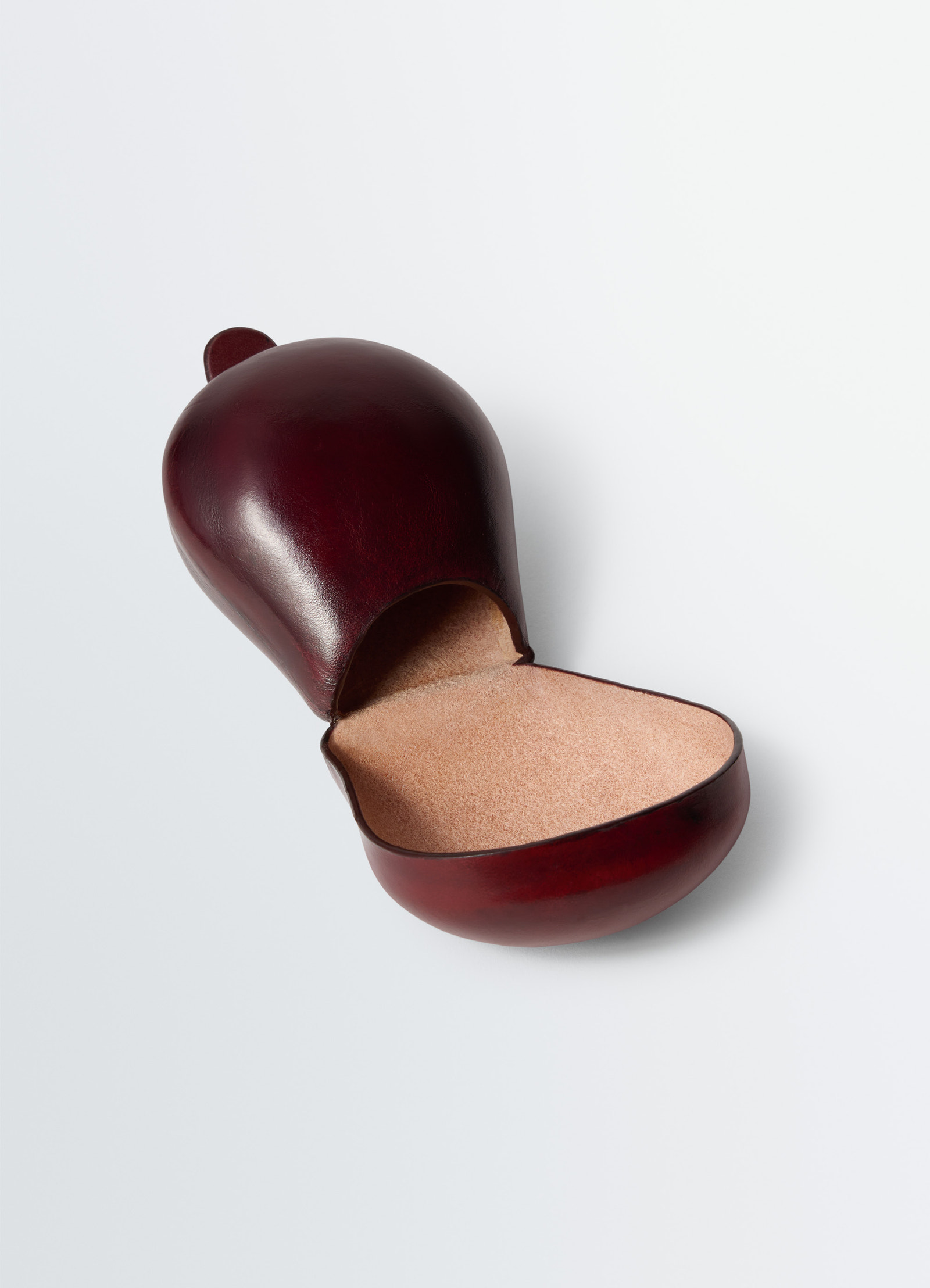 Carlos castanet coin purse in smooth patina leather, product shot, angled open side view elegantly domed top