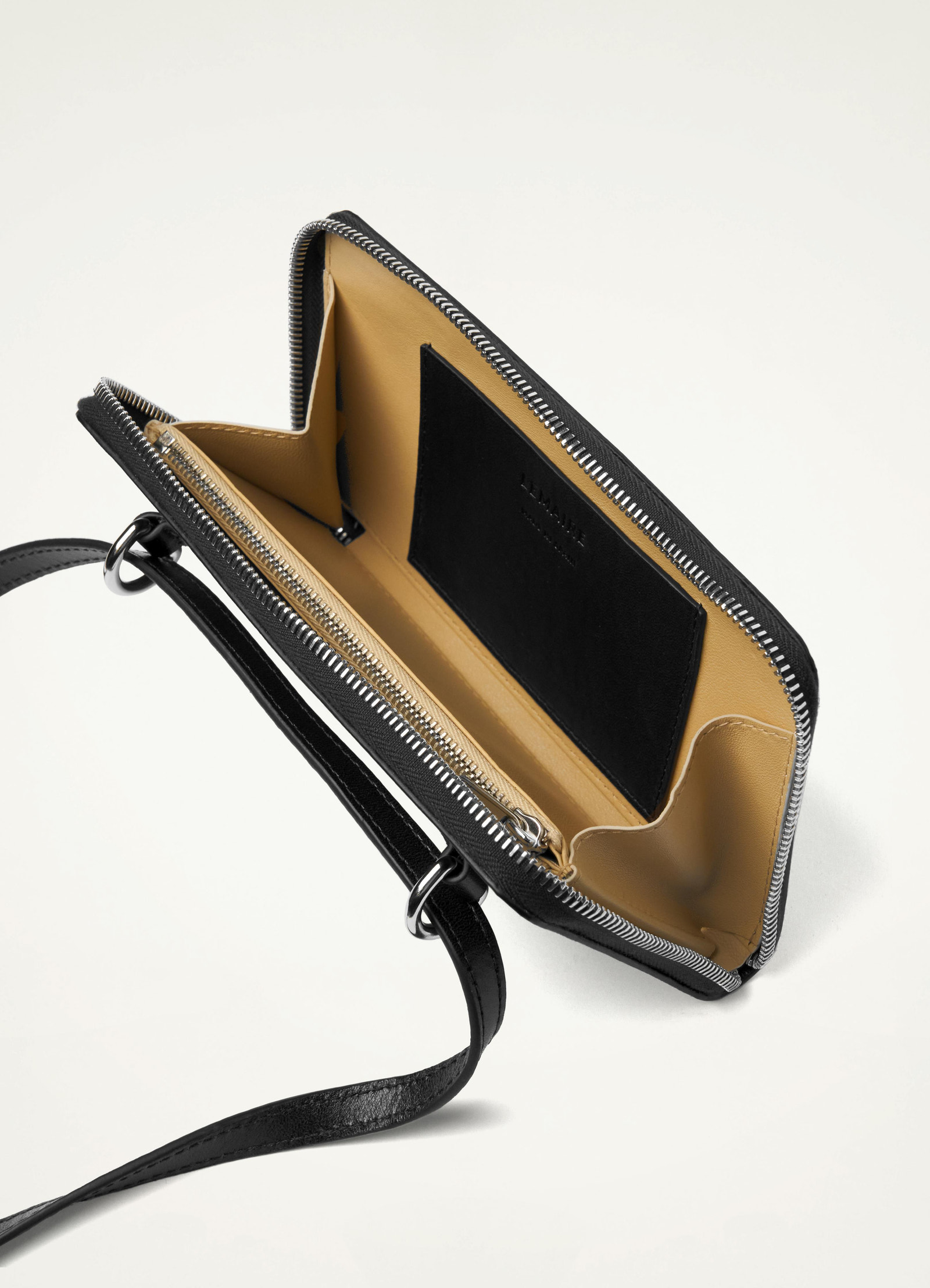 Continental wallet with strap in vegetable-tanned buffalo leather, product shot, interior detail shot organized compartments
