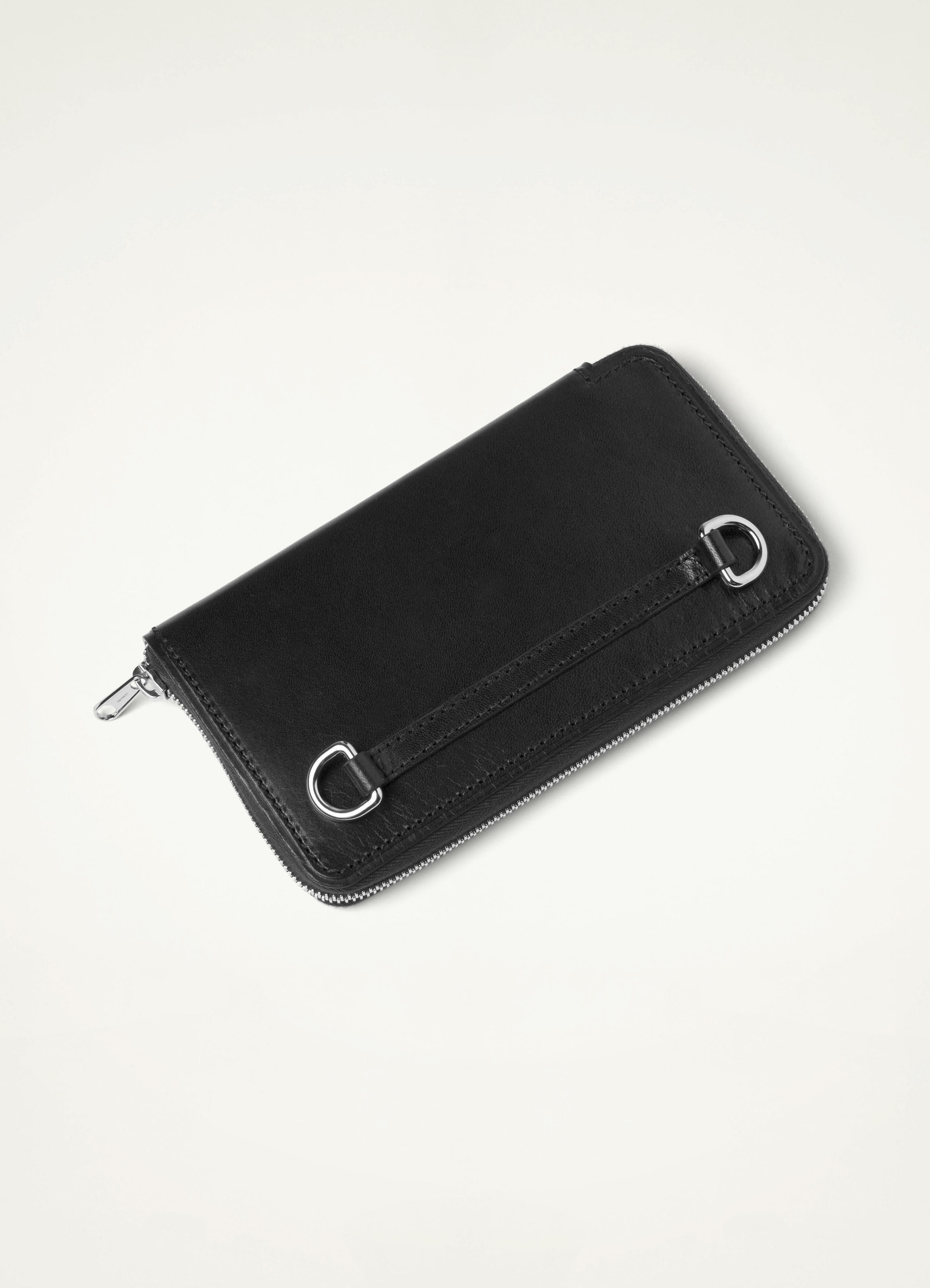 Continental wallet with strap in vegetable-tanned buffalo leather, product shot, angled side view smooth texture with zipper