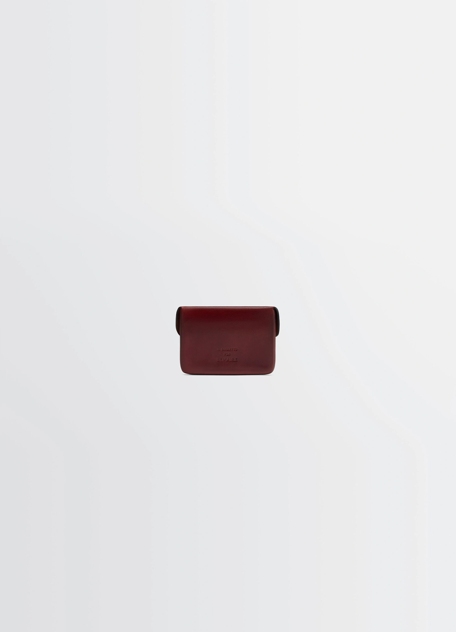 Il bussetto for lemaire card holder in patinated vegetable-tanned leather, product shot, back view smooth finish, embossed lo