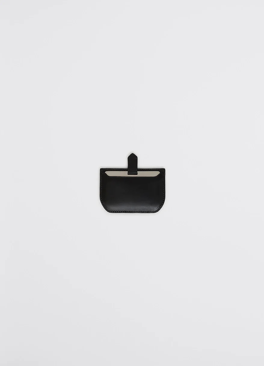 Calepin mirror & card holder in black leather, product shot, front view rounded edges with snap closure