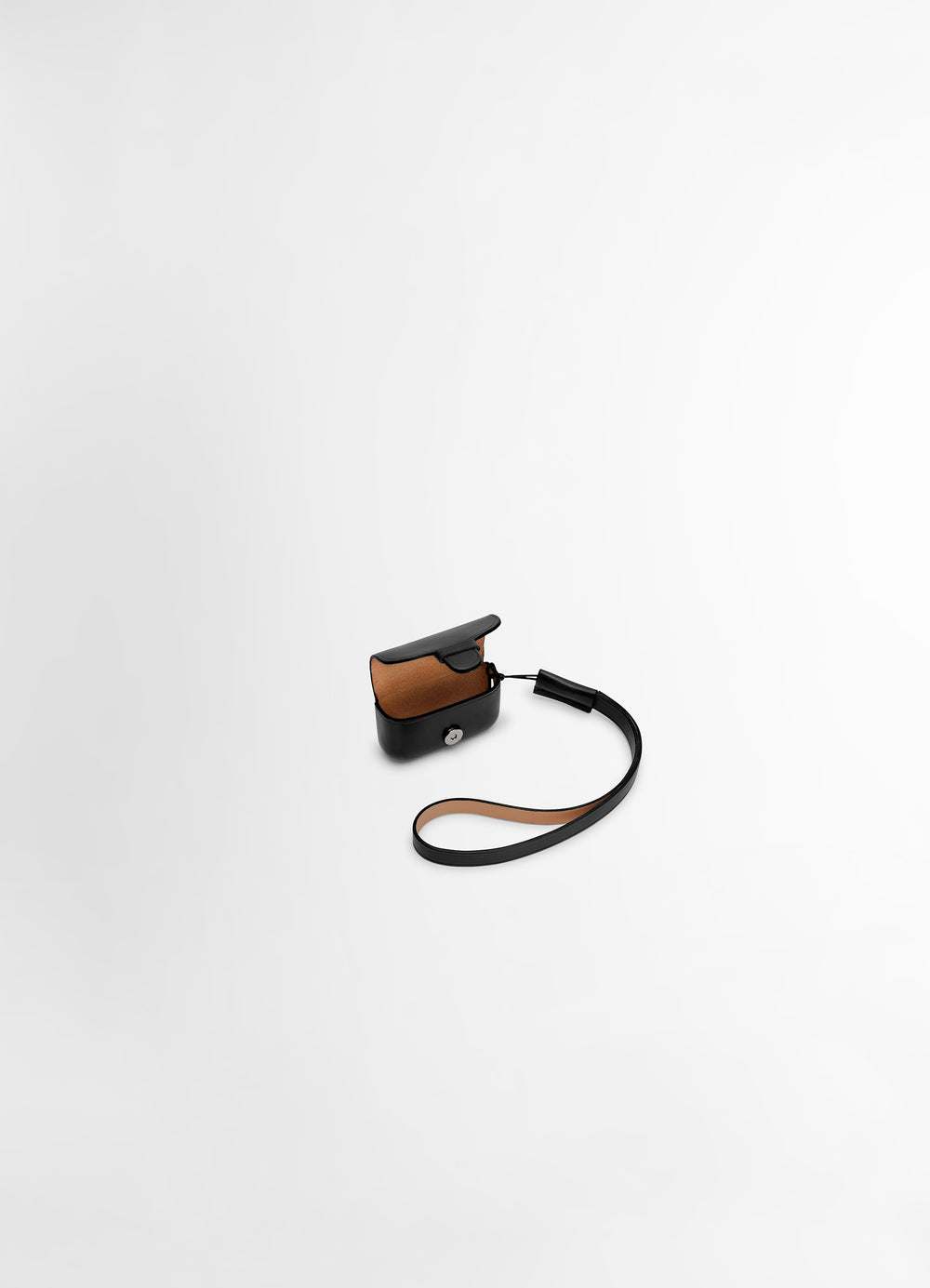 IL BUSSETTO FOR LEMAIRE AIRPODS PRO in patinated vegetable-tanned leather, product shot, side view includes detachable strap