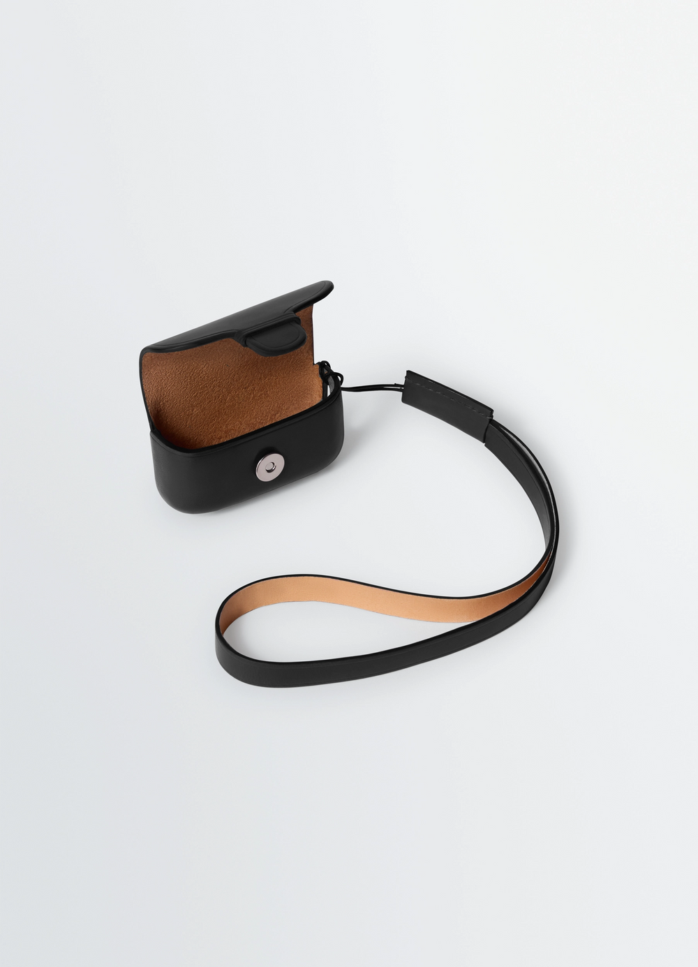 IL BUSSETTO FOR LEMAIRE AIRPODS PRO in Molded vegetable-tanned leather, product shot, angled top view open case with strap