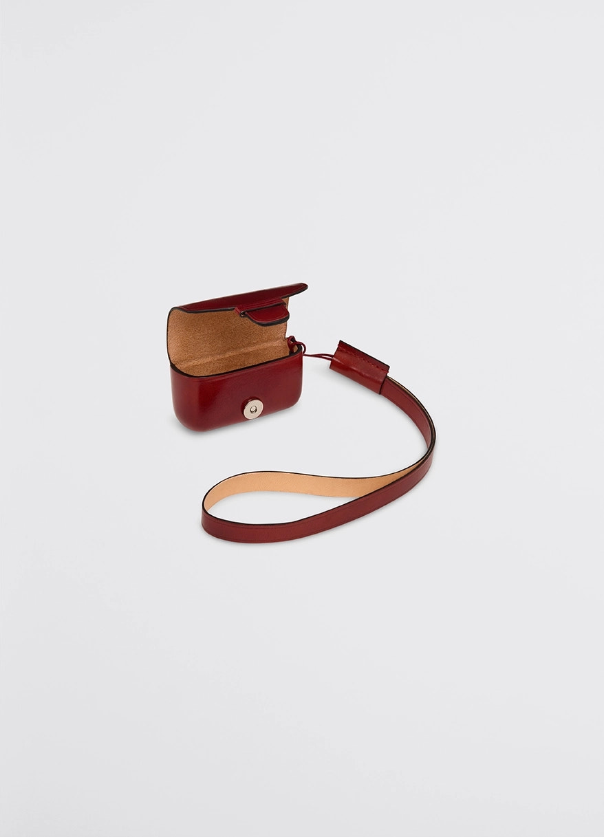 Il bussetto for lemaire airpods pro in vegetable-tanned cowhide, product shot, top perspective view open case with long strap