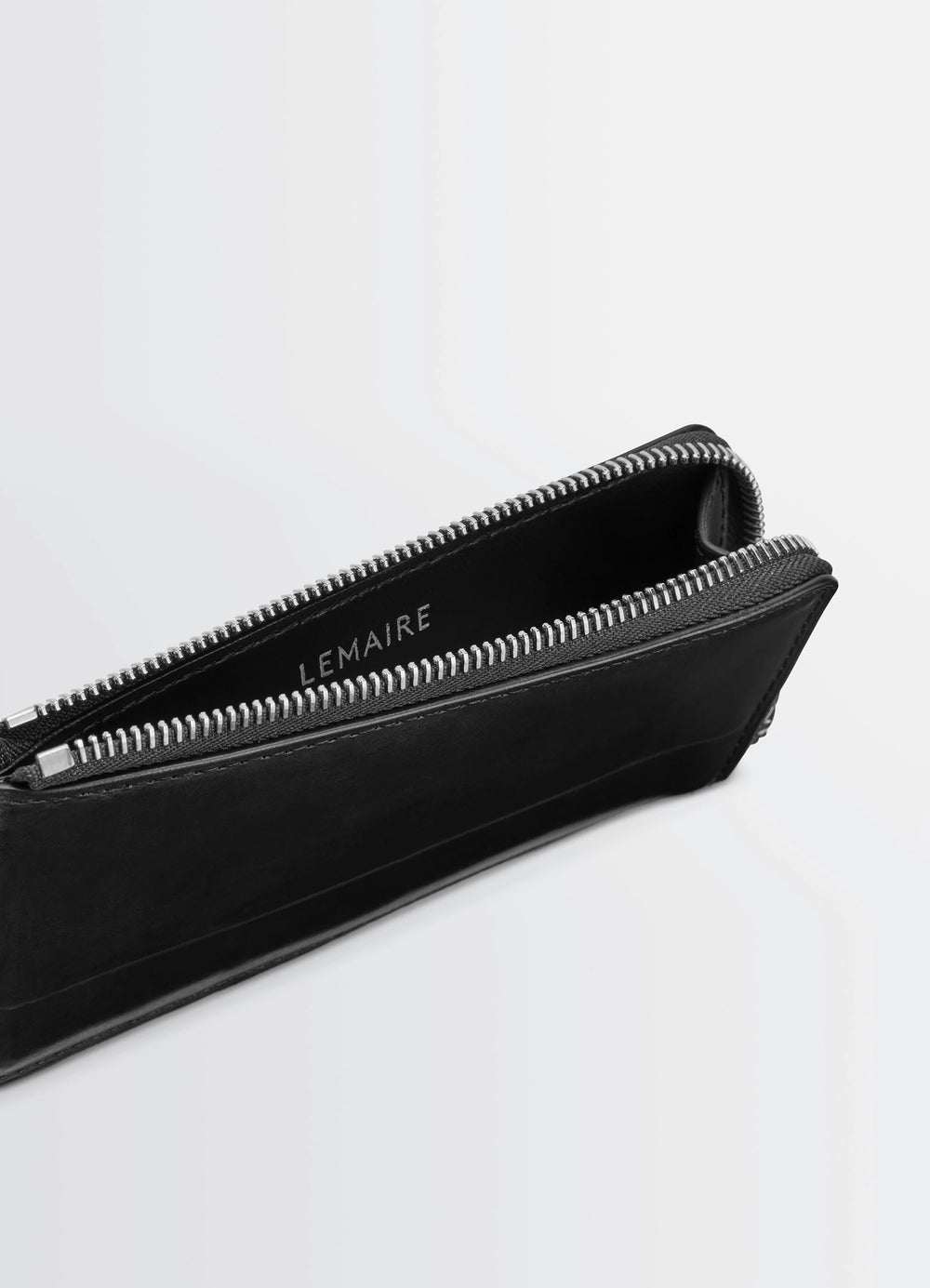 Patina Zip Coin Card Holder in Patinated Leather, product shot, angled top view exposed zipper detail