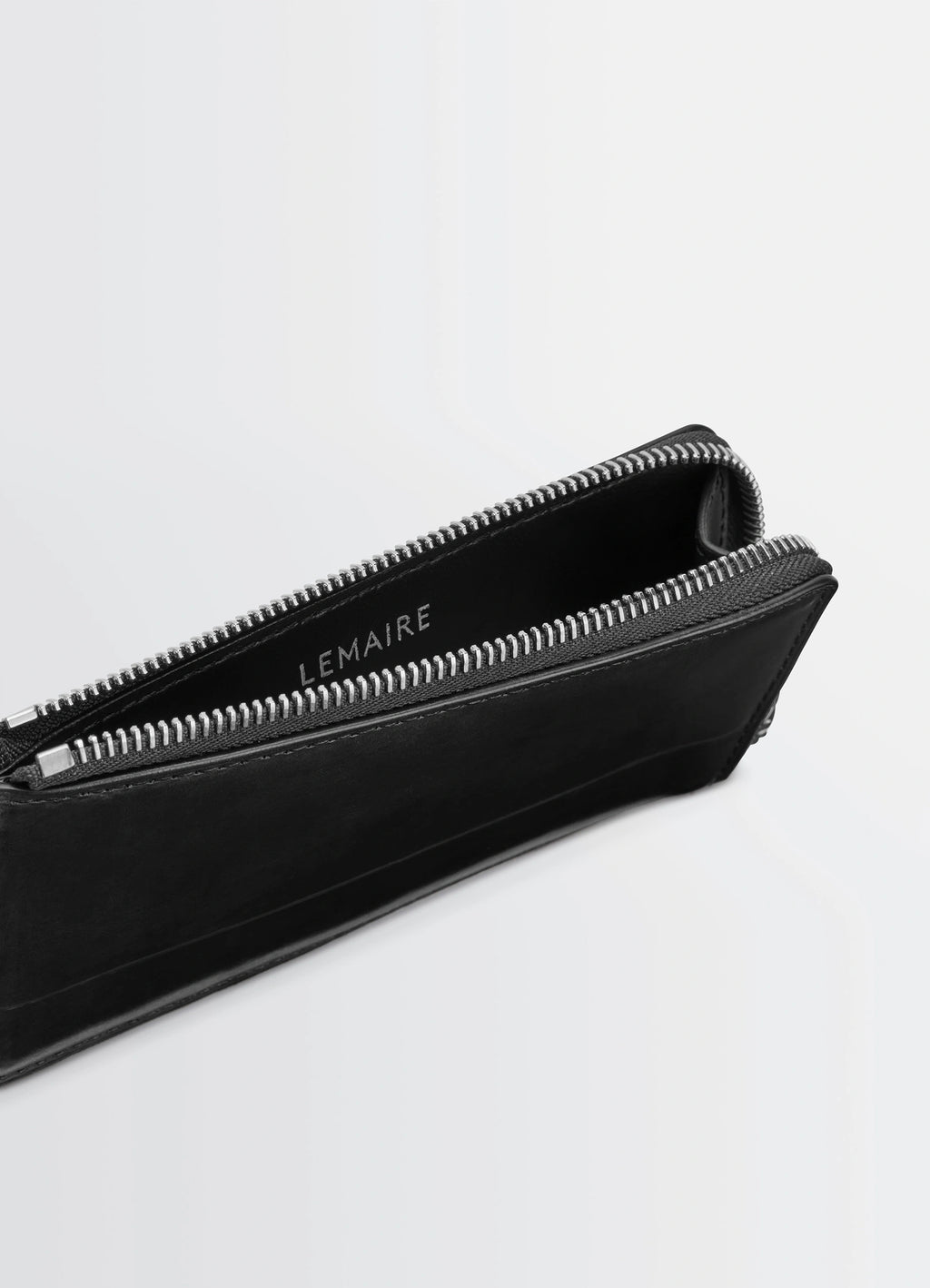 Patina Zip Coin Card Holder in Patinated Leather, product shot, angled top view exposed zipper detail