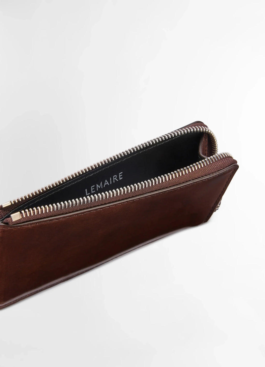 Patina Zip Coin Card Holder in soft black leather, product shot, angled top view open zipper compartment