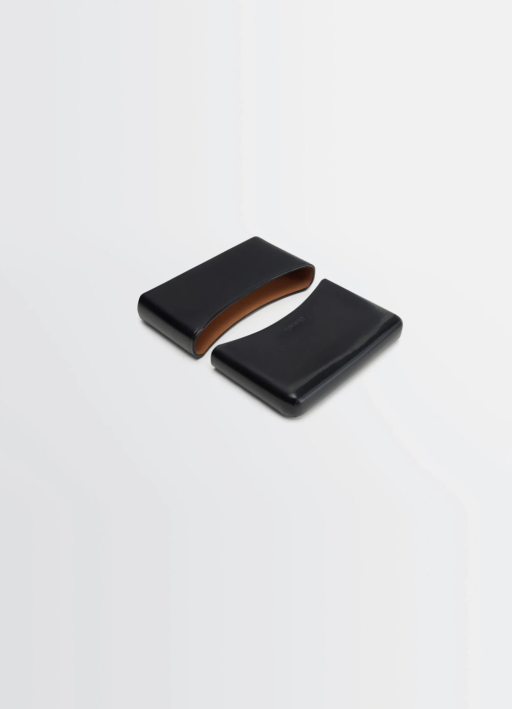 Lemaire Molded Card Holder in Patinated Silver Leather, product shot, angled top view curved edge design