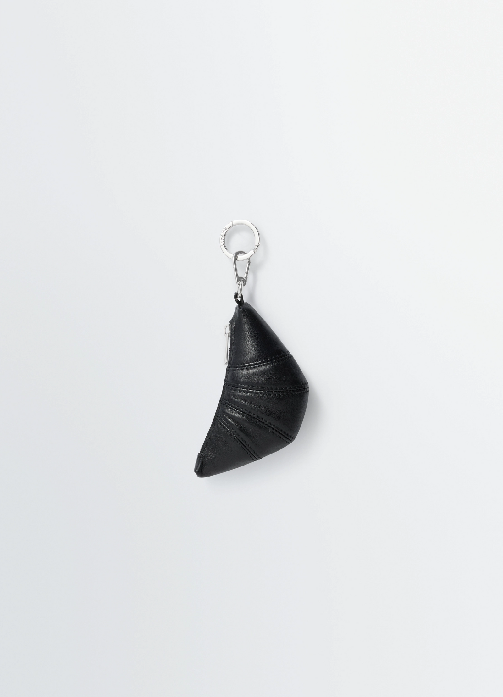 Mini croissant keyring in nappa leather, product shot, side view folded half-moon shape