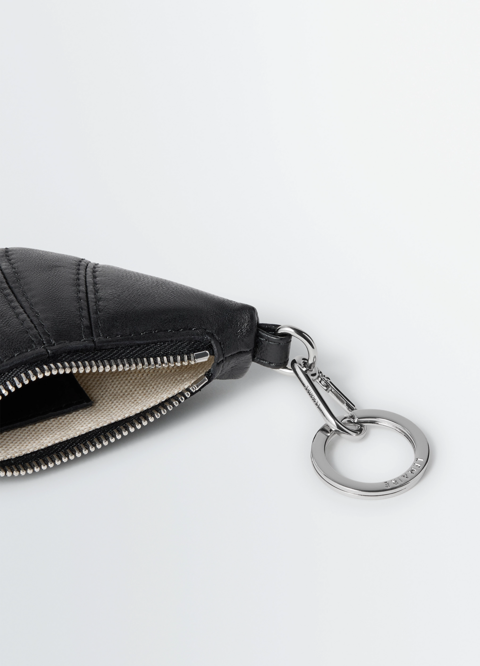 Mini croissant keyring in nappa leather, product shot, top angle shot visible zipper detail