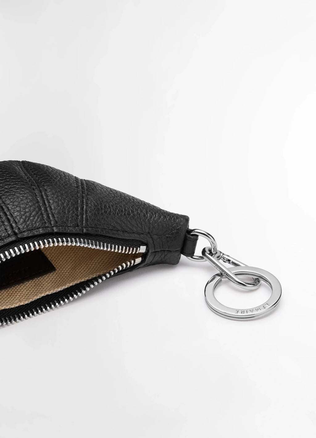 Mini Croissant Keyring in Grained Leather, product shot, top angle zipper detail visible