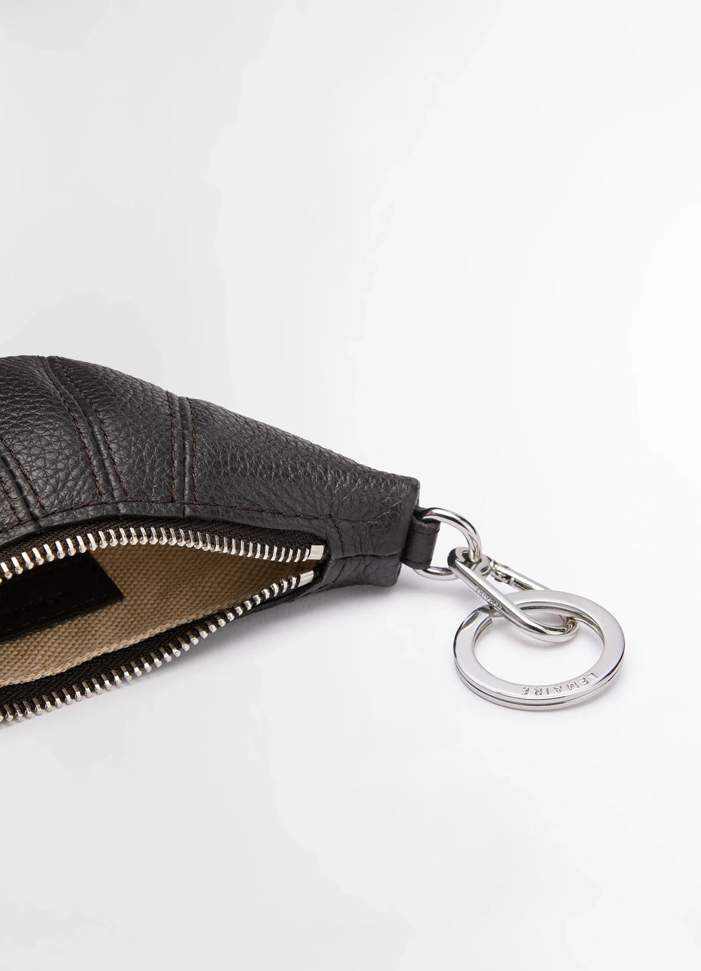 Mini Croissant Keyring in Grained Leather, product shot, top angled view open zipper detail