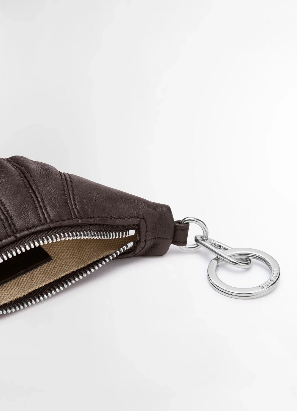 Mini Croissant Keyring in Nappa Leather, product shot, angled close-up exposed zipper
