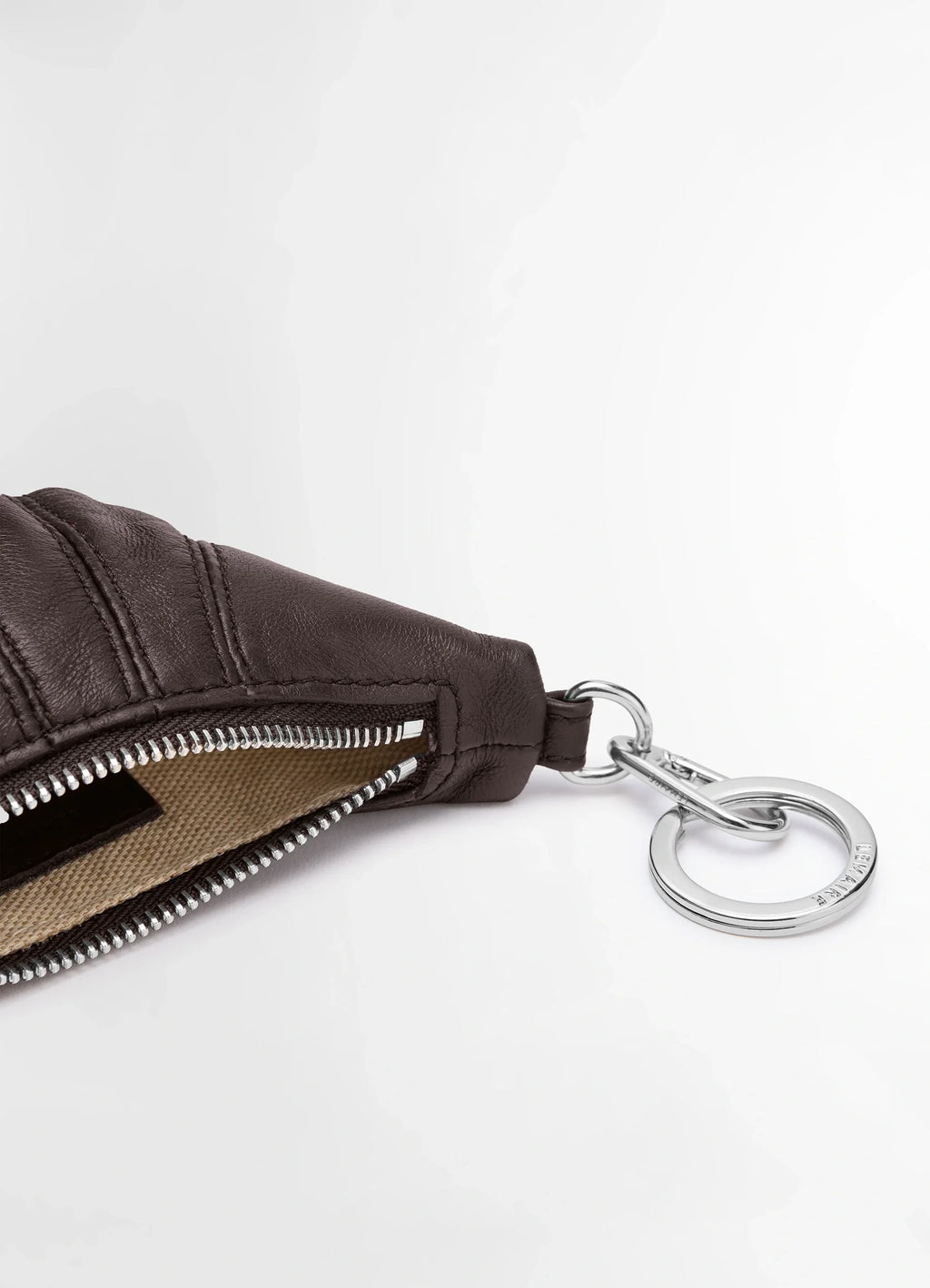 Mini Croissant Keyring in Nappa Leather, product shot, angled close-up exposed zipper