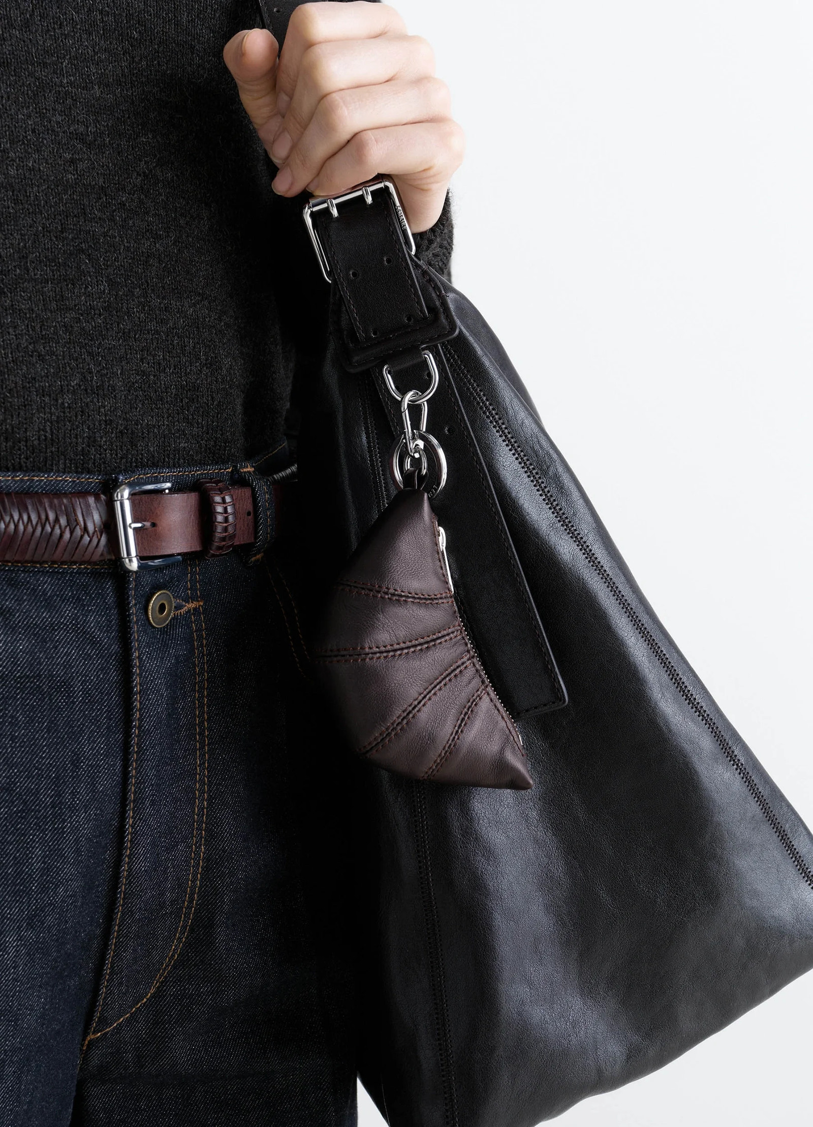 Mini croissant keyring in nappa leather, detail shot half-moon shape topstitched