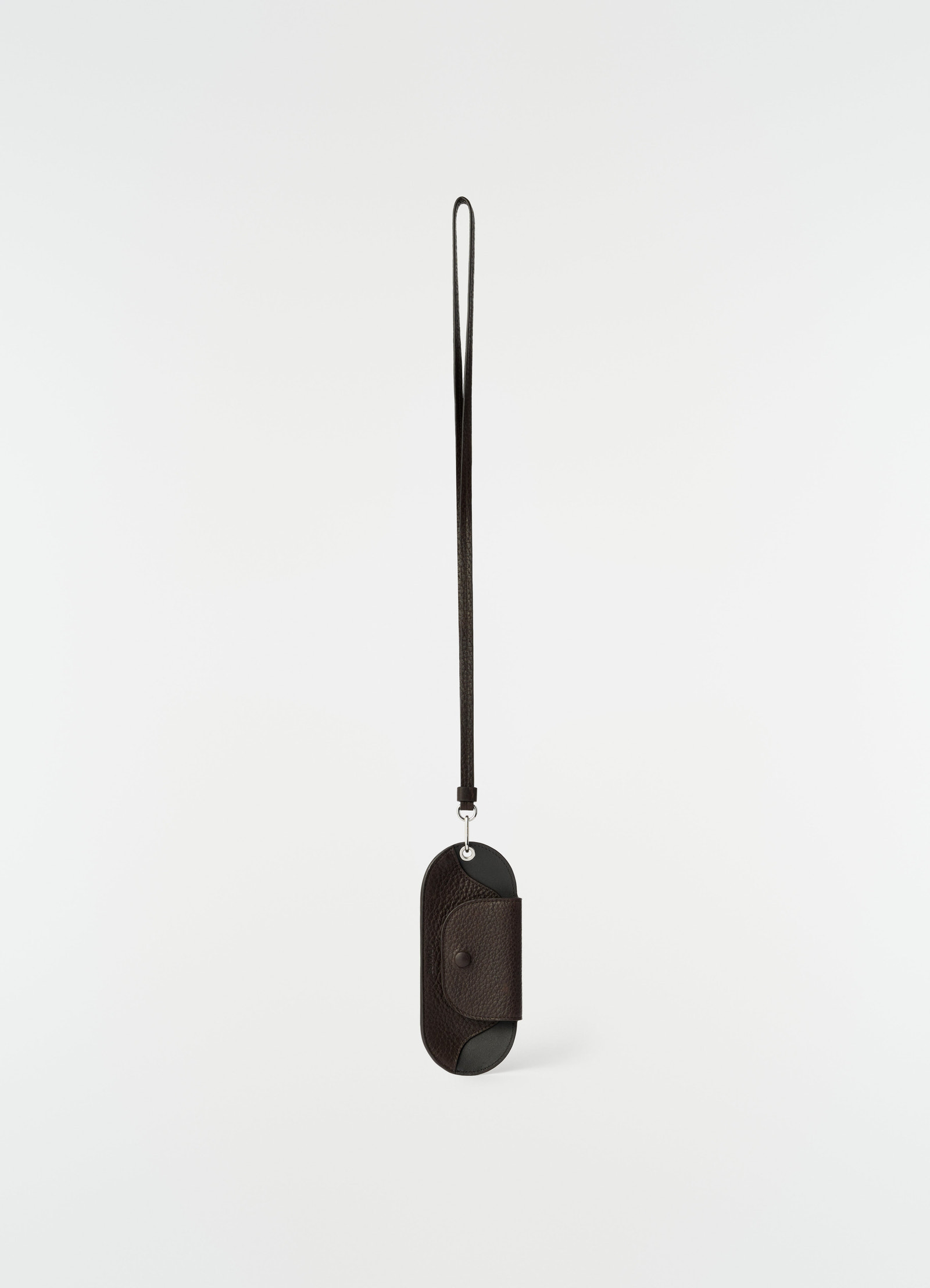 Glasses case in dark brown glossy vegetable-tanned leather with strap by lemaire front on white background