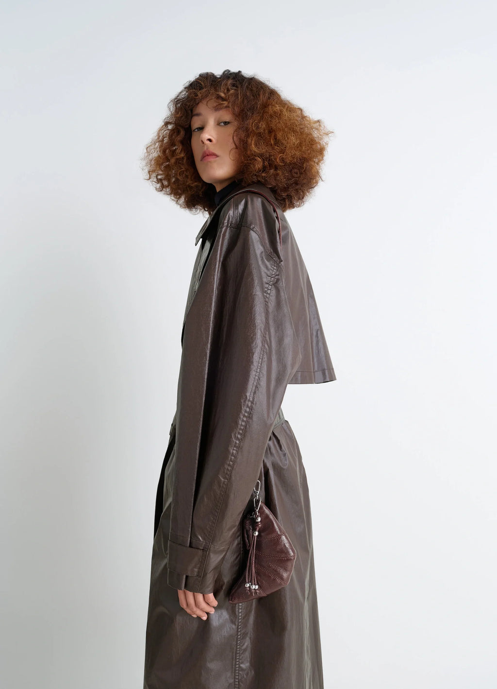 Crossbody Croissant Coin Purse in Coated Cotton Canvas, model shot, back view tassel detail