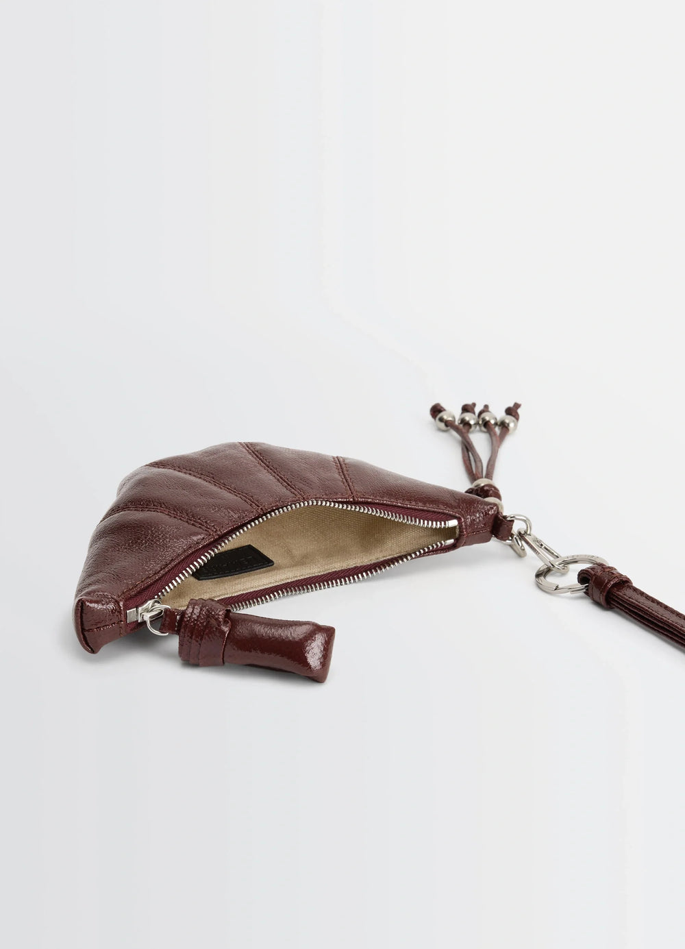 Crossbody Croissant Coin Purse in Coated Cotton Canvas, product shot, zipper open detail view lined interior with tassel