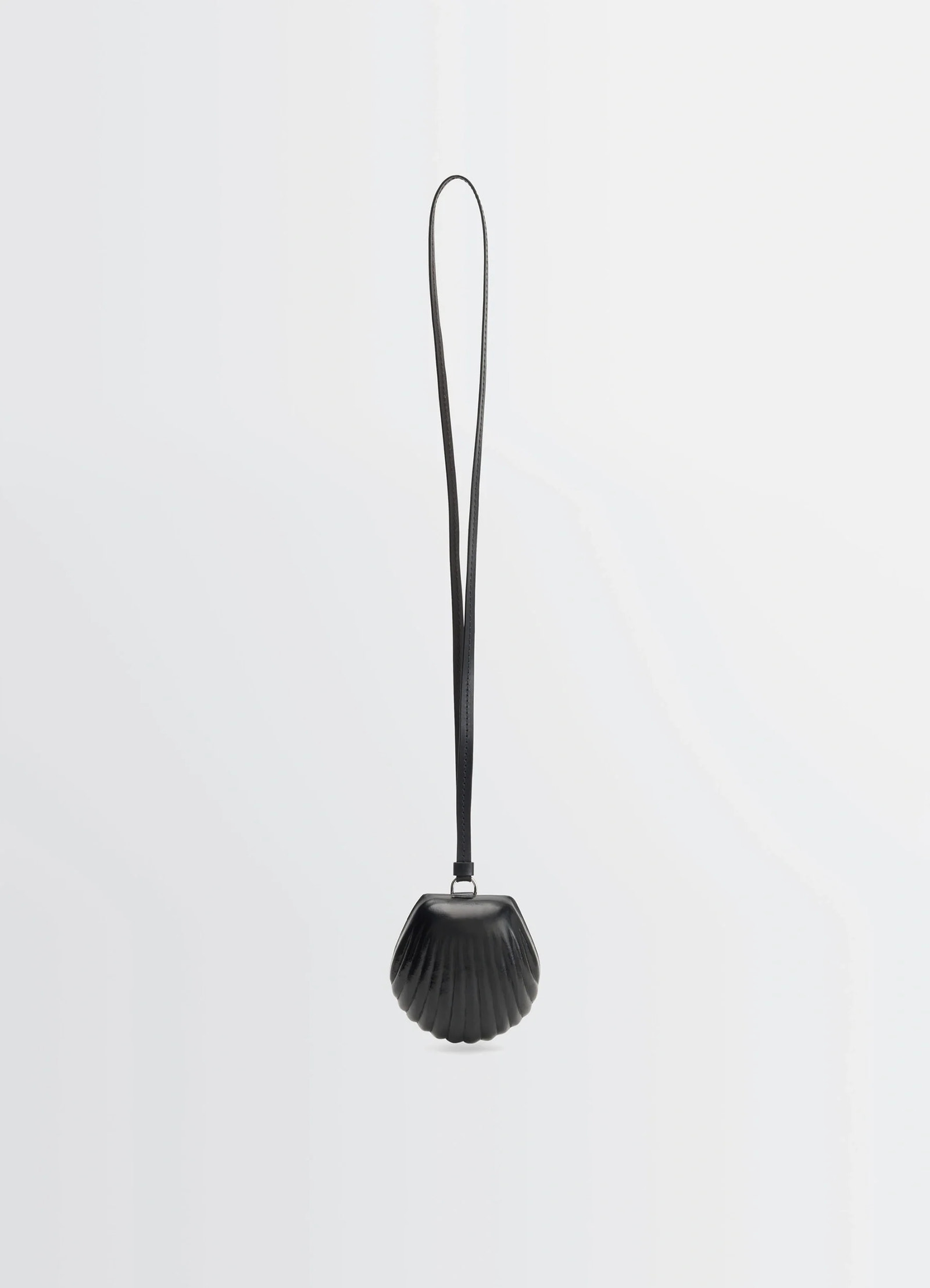 Carlos shell coin purse necklace in black vegetable-tanned leather, product shot, front view seashell shape