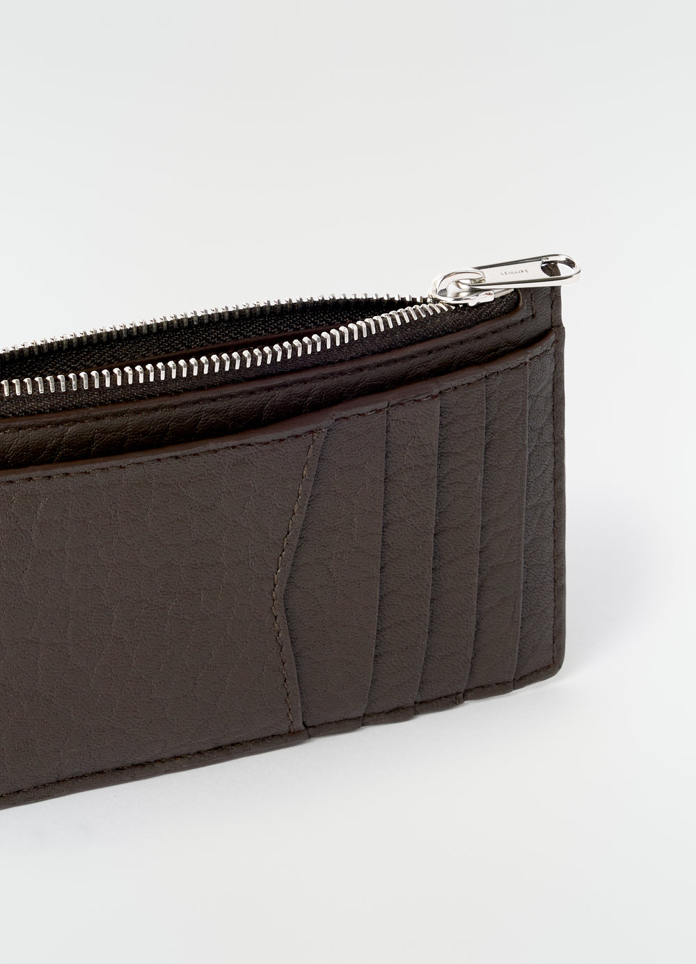 Gear card and coin holder in dark brown bubble lambskin with silver zipper detail LEMAIRE close-up front view