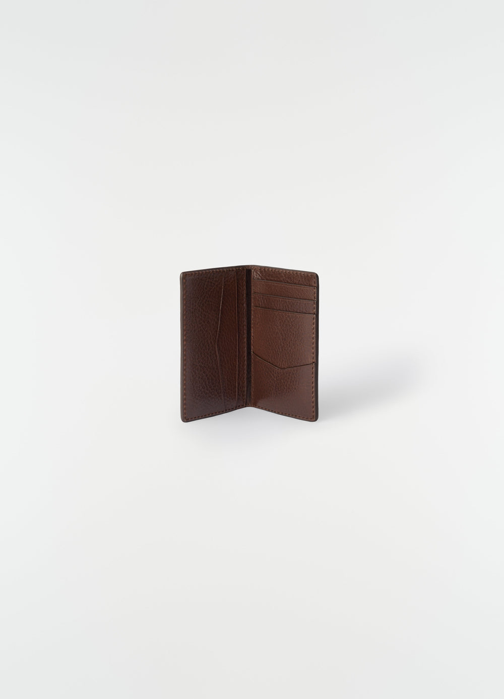 Gear pocket organizer in brown leather by LEMAIRE open front view on plain white background
