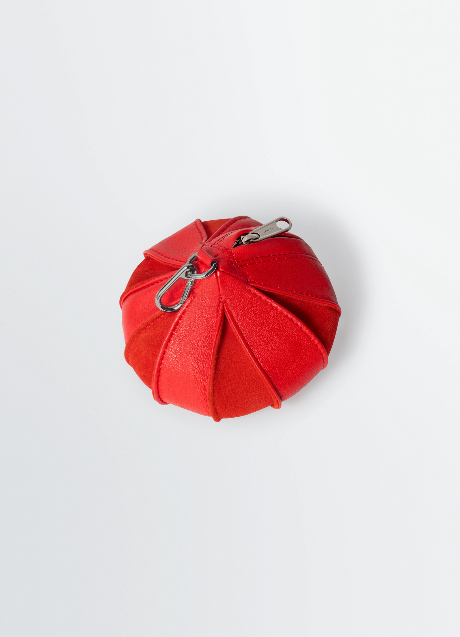 Balloon bag charm in red lamb nappa leather, product shot, top angle view striped panel texture