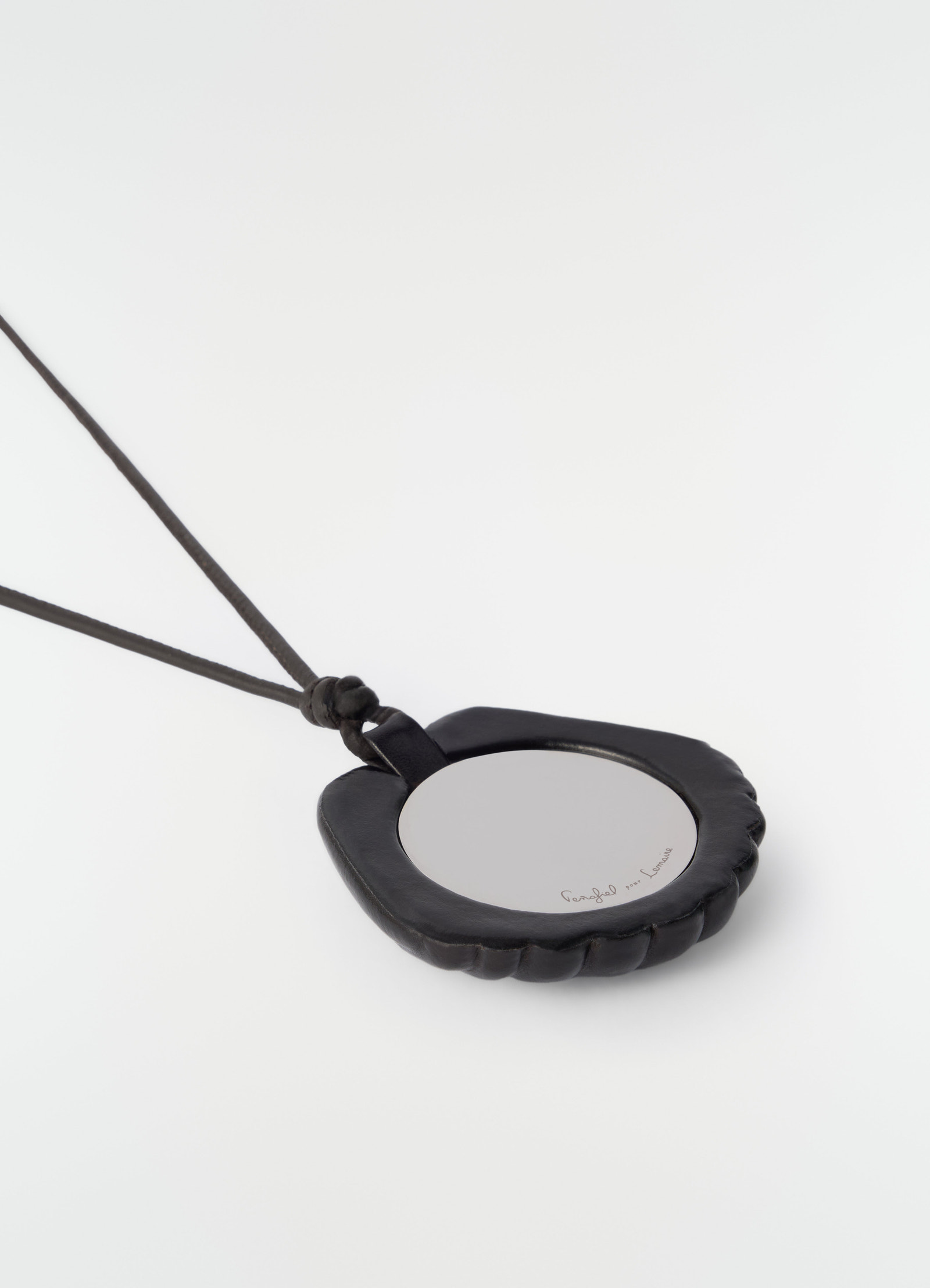 Shell mirror pendant in black patinated calfskin leather by lemaire on plain white background detail