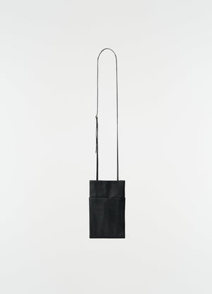 Book pouch black grained leather lemaire front view with long strap on white background