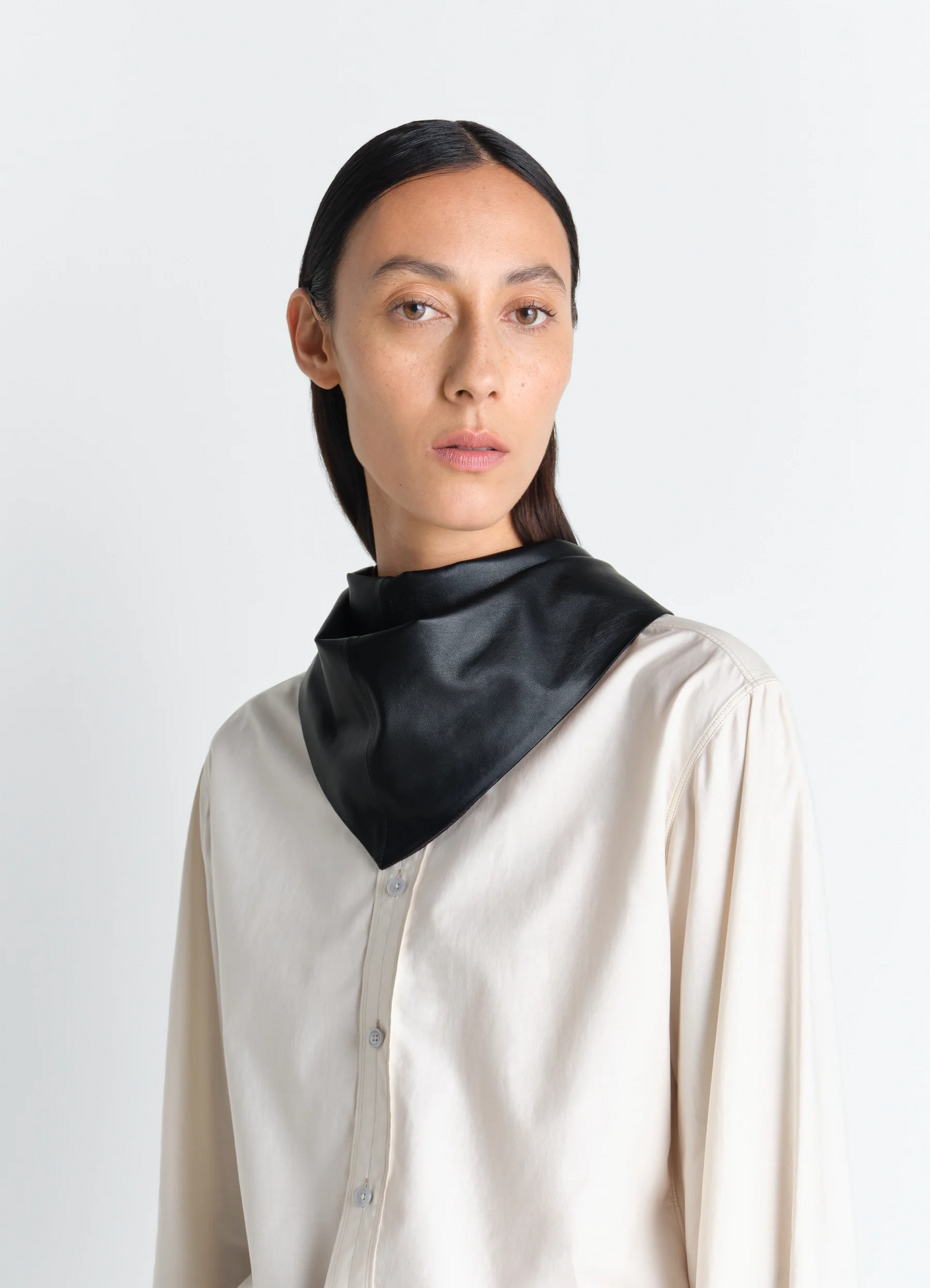 Leather triangle scarf in nappa lamb leather, model shot, worn by model side view draped around neck