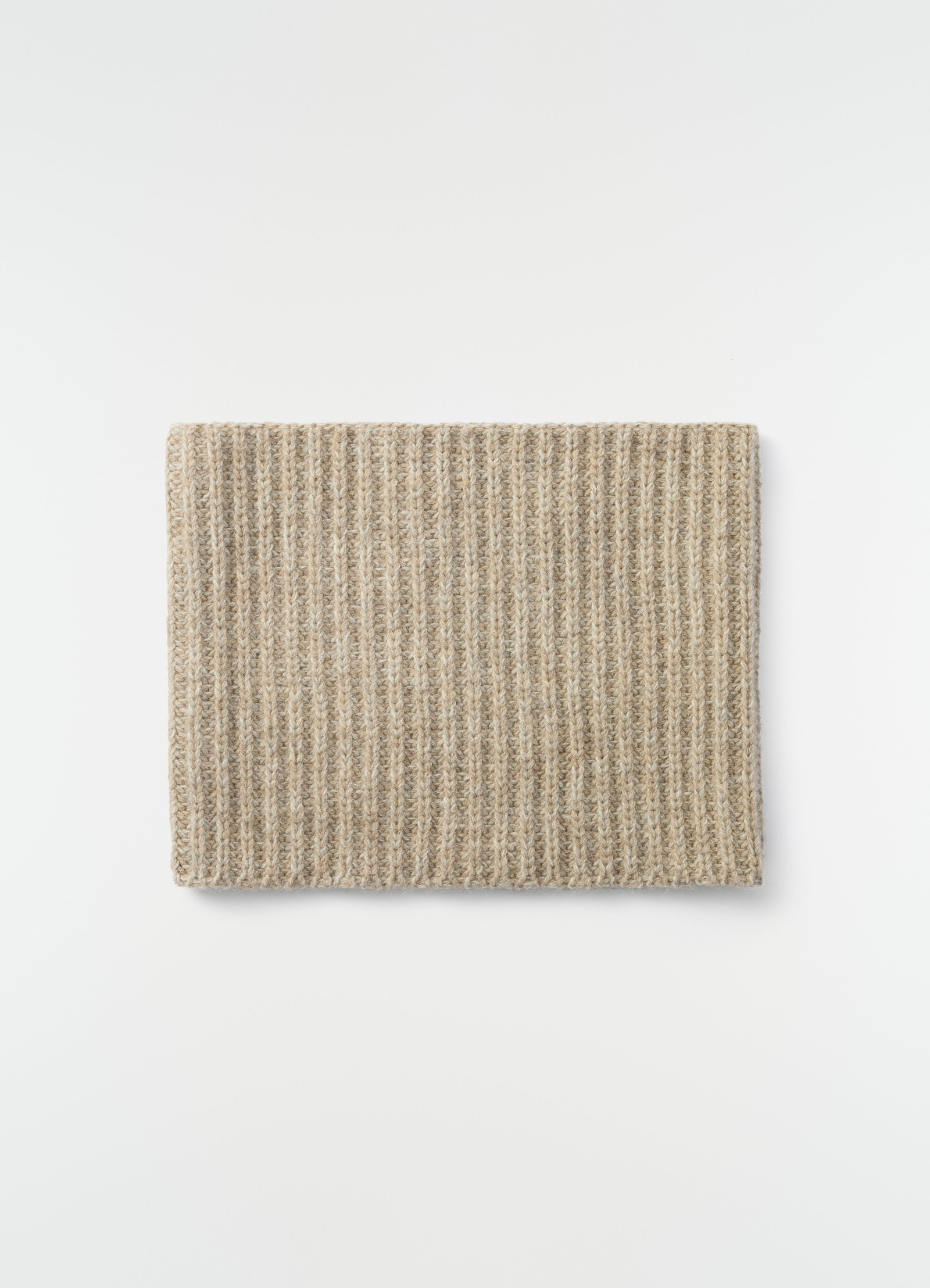 Neck warmer in beige alpaca and yak wool blend by lemaire styled flat on white background