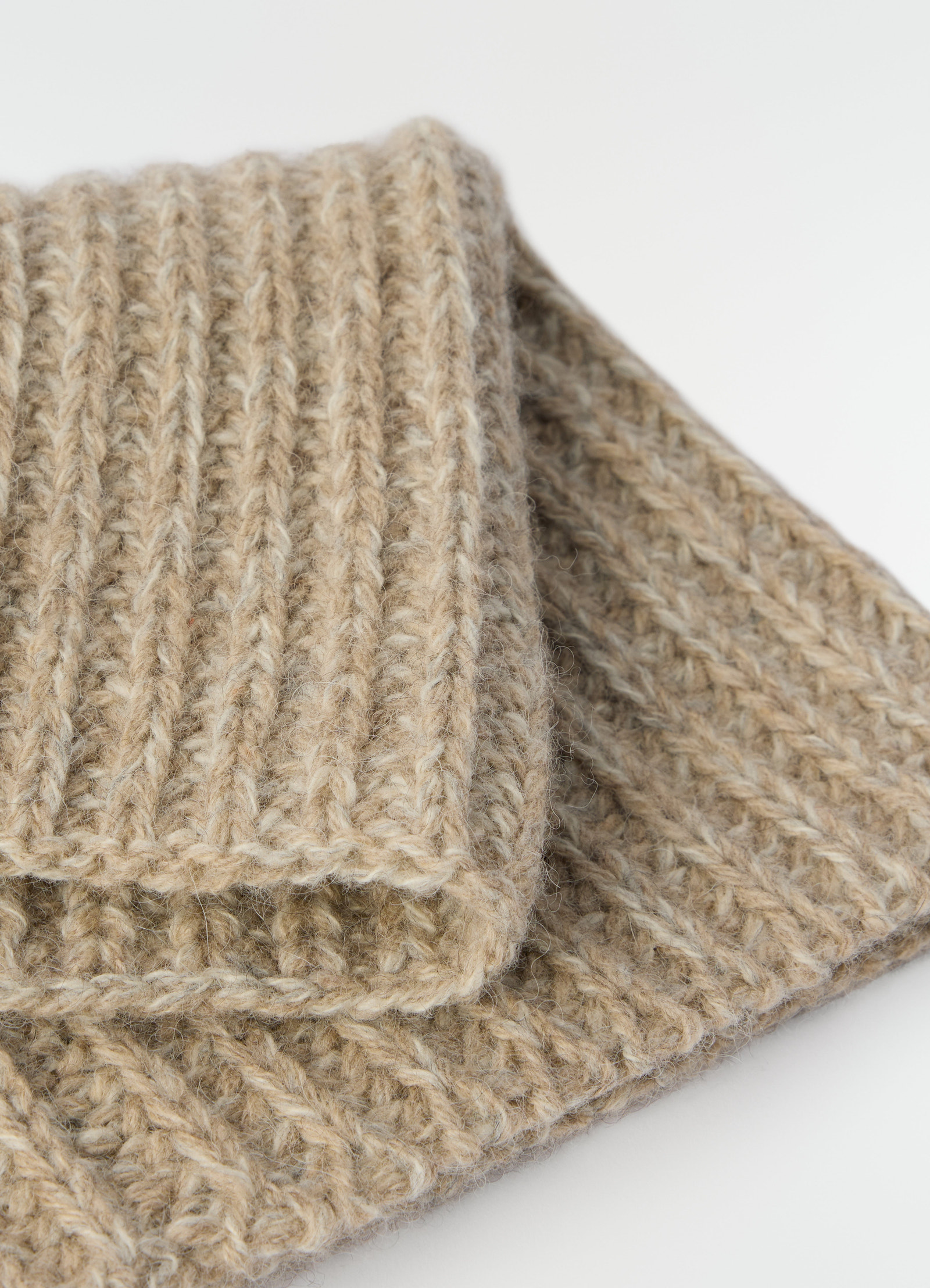 Neck warmer in beige alpaca and yak wool blend by lemaire close-up detail on white background