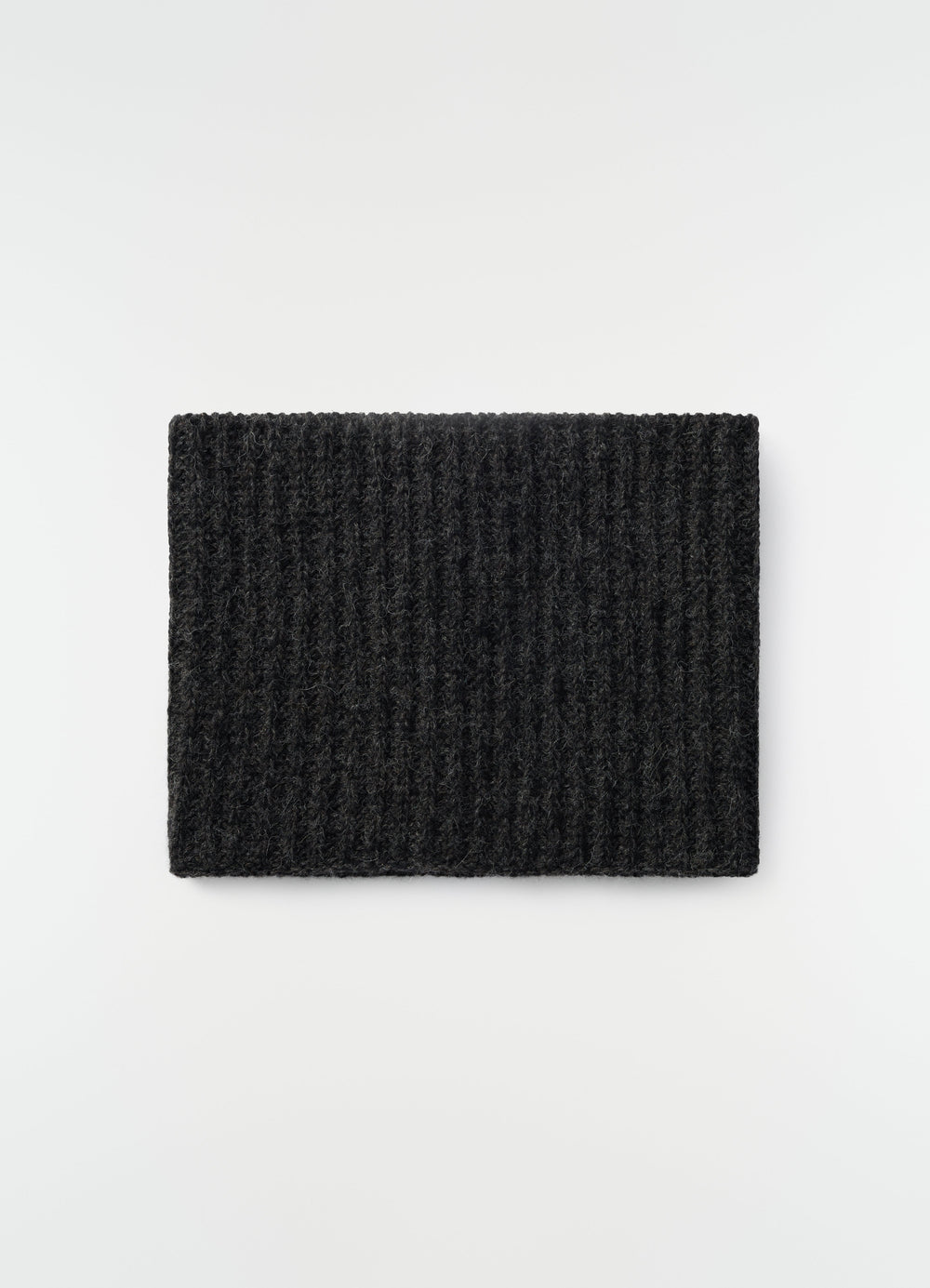 Neck warmer in black alpaca and yak wool blend by LEMAIRE flat lay on white background
