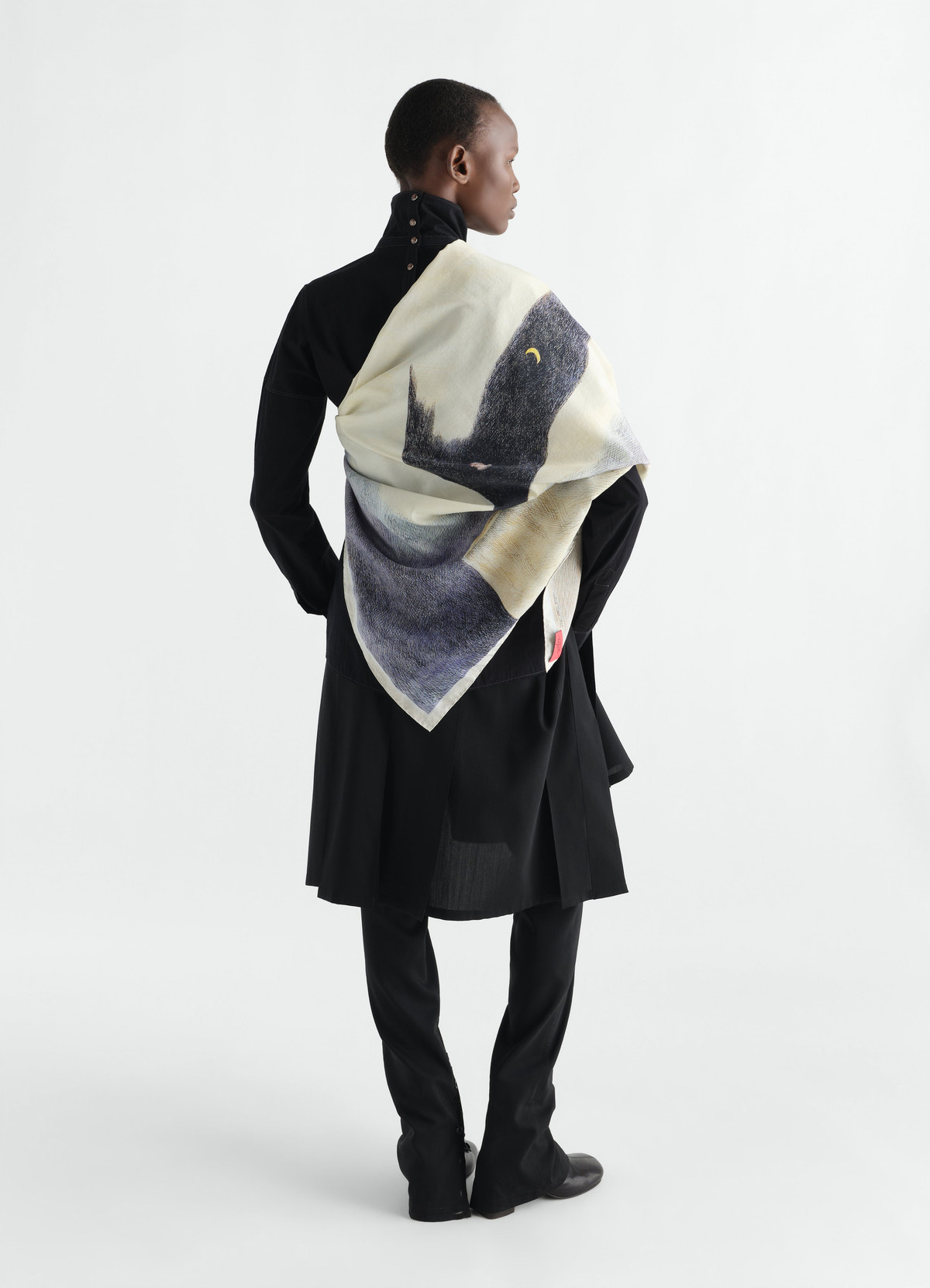 Printed “la nuit 1972” silk blend scarf in cream and black by lemaire worn by model back view