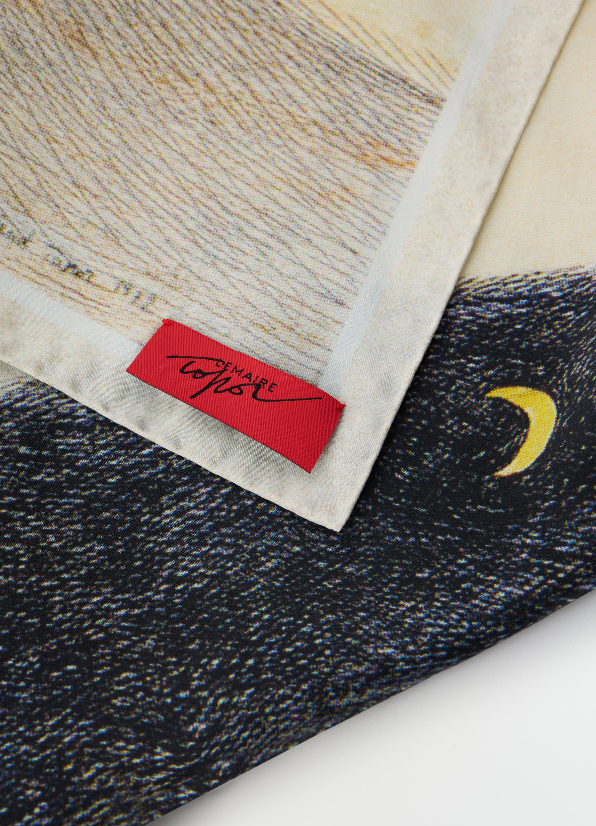 Printed “la nuit 1972” silk blend scarf with moon detail by lemaire close-up on fabric and label