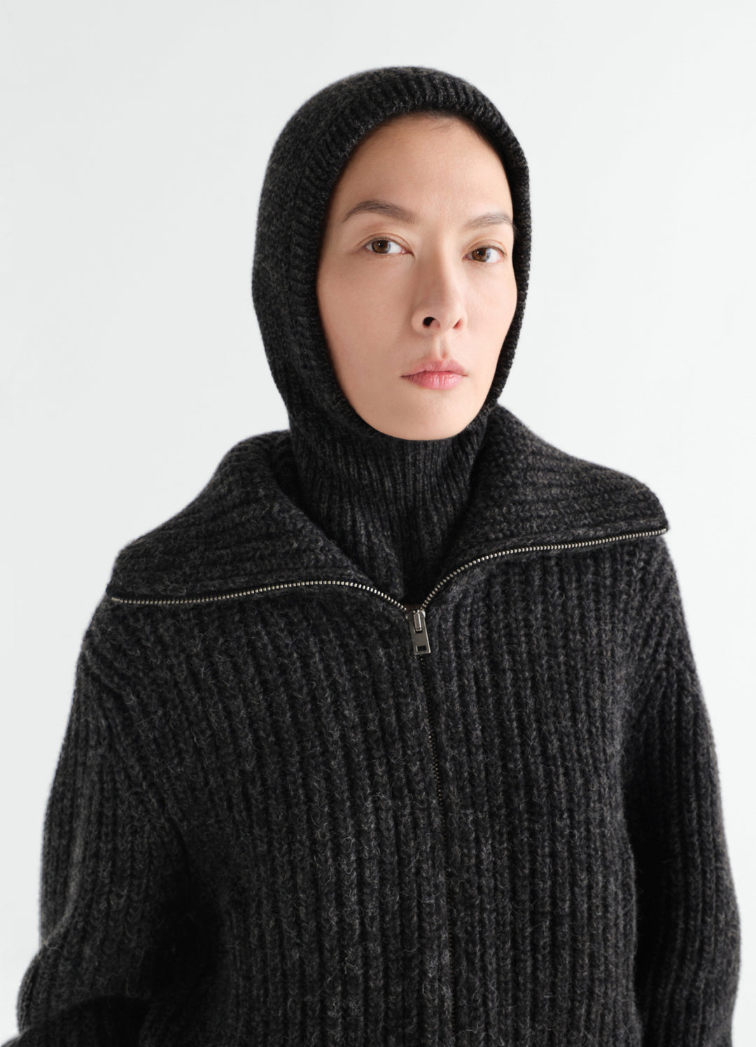 Balaclava in black alpaca and yak wool blend worn by model front close-up LEMAIRE