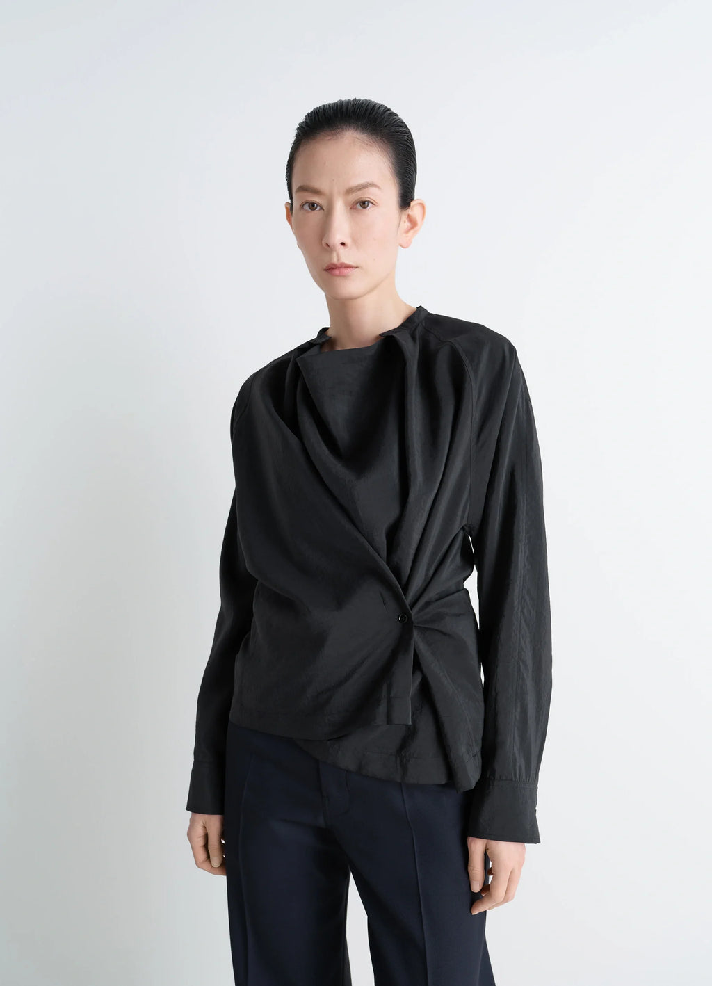 Lemaire Twisted Top in Black Dry Silk Blend, model shot, front view long-sleeved fitted cut