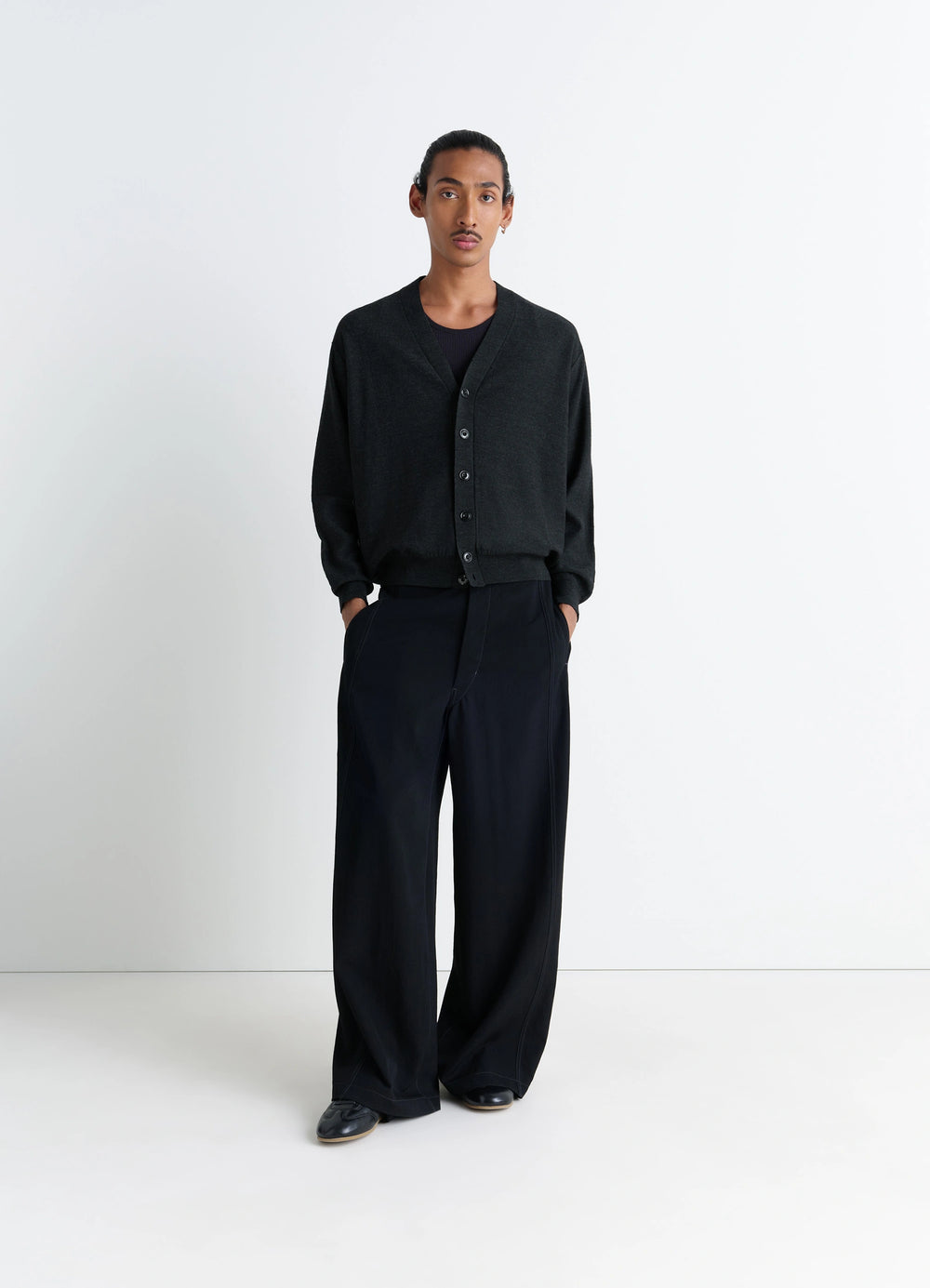 Lemaire Relaxed Twisted Cardigan in Blended merino wool, model shot, full body view ribbed cuffs, casual fit